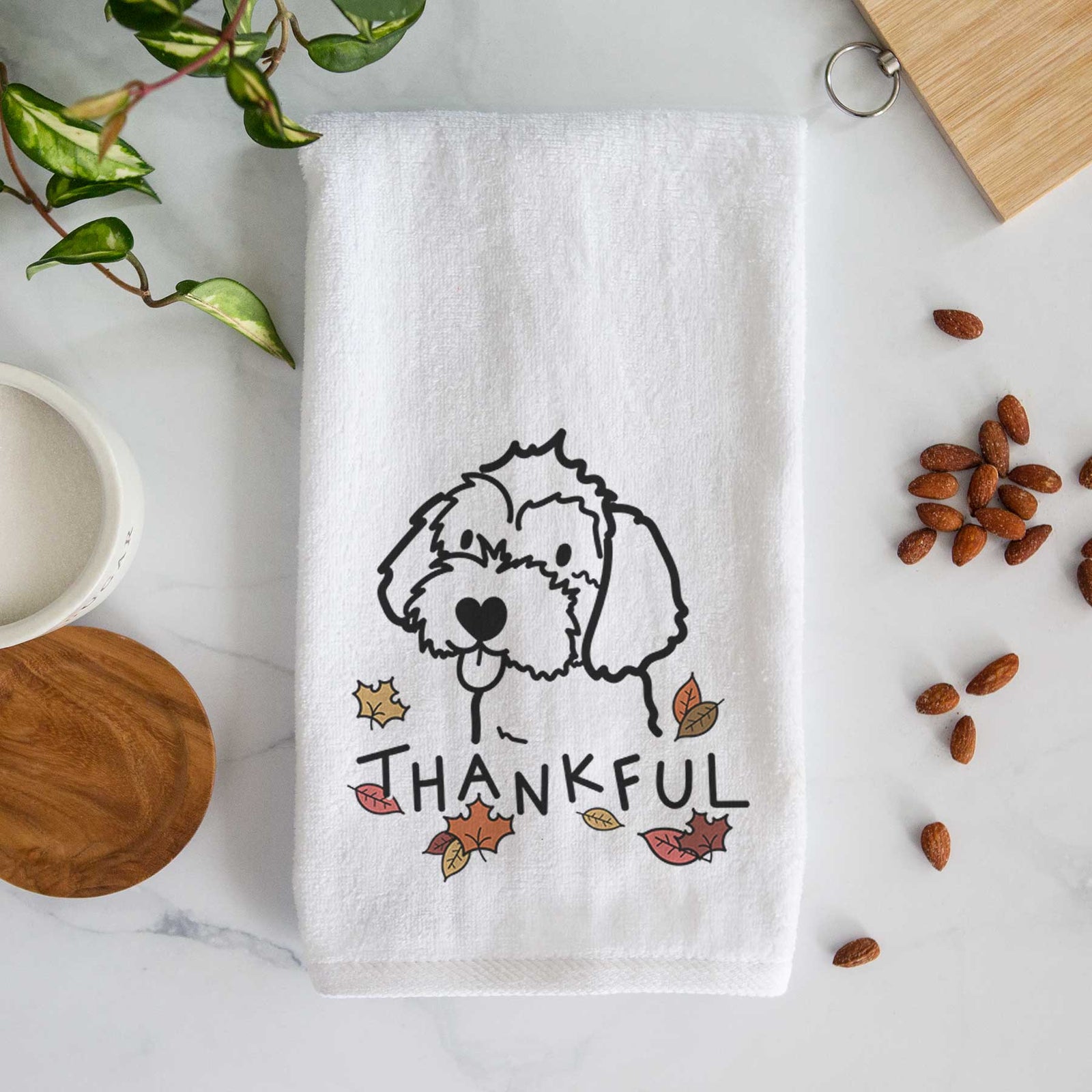 Minimalist line drawing of a Havapoo with 'Thankful' lettering on a decorative hand towel
