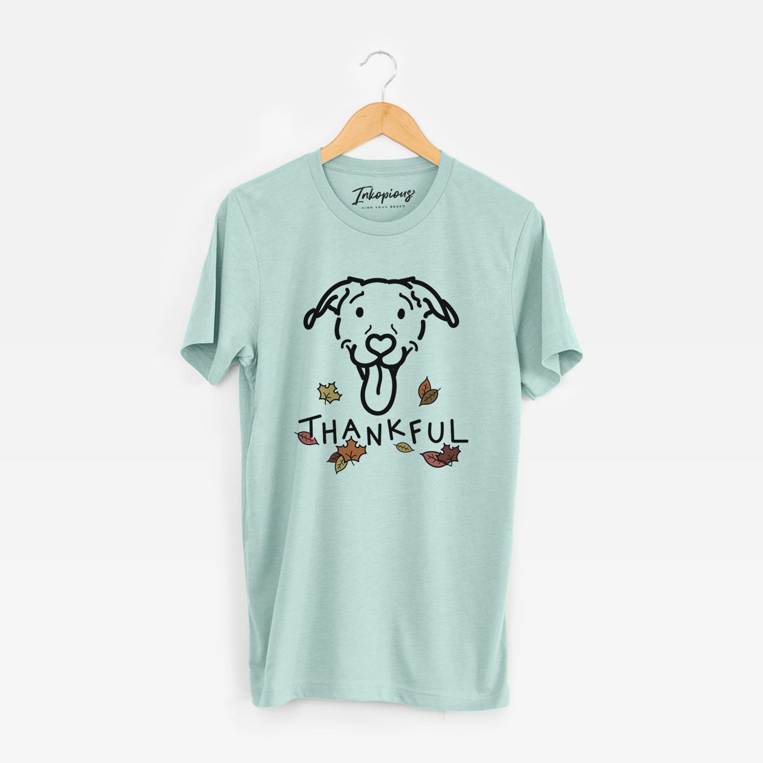 Minimalist line drawing of Hemi the Pitbull Mix with 'Thankful' lettering on a Heather Sage Unisex crewneck