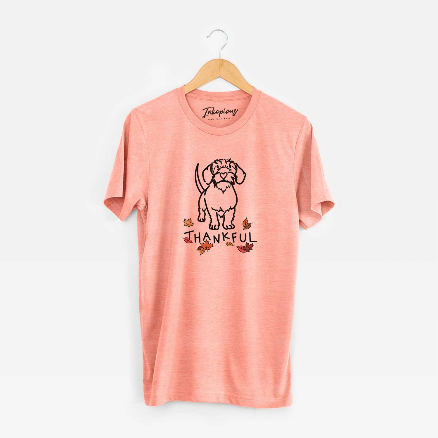 Minimalist line drawing of Henry the Wire Dachshund with 'Thankful' lettering on a Sunset Unisex crewneck