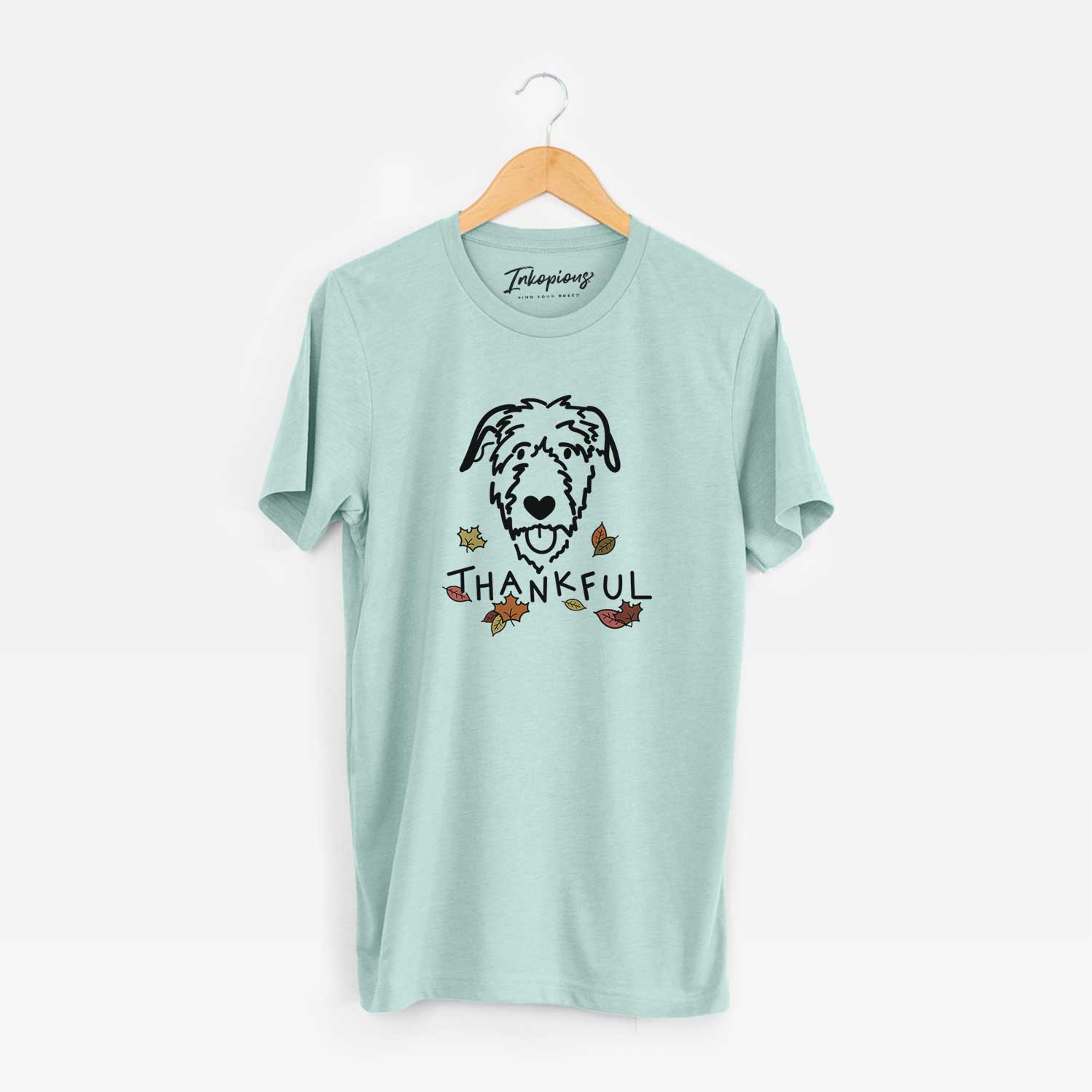 Minimalist line drawing of an Irish Wolfhound with 'Thankful' lettering on a Heather Sage Unisex crewneck