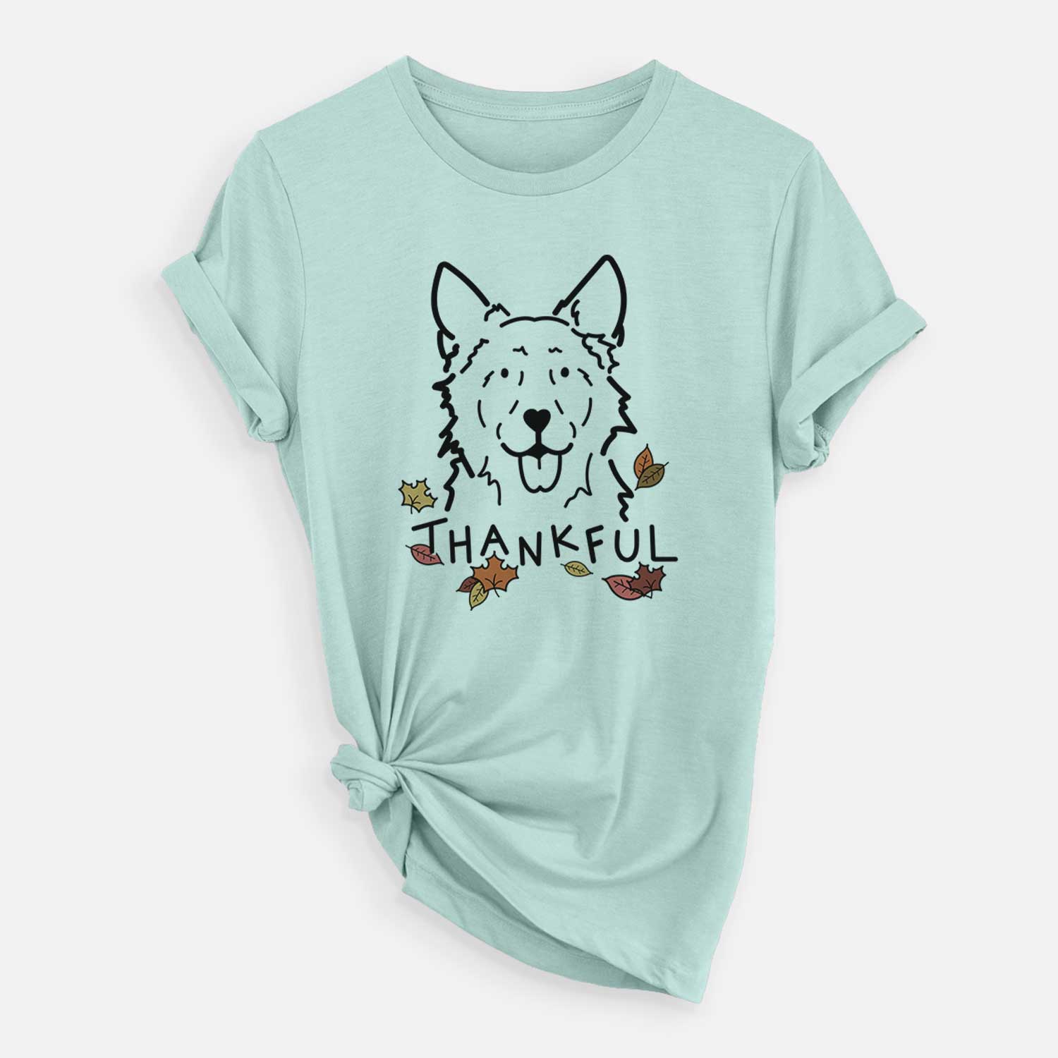 Minimalist line drawing of Jack the Mudi with 'Thankful' lettering on a Heather Sage Unisex crewneck