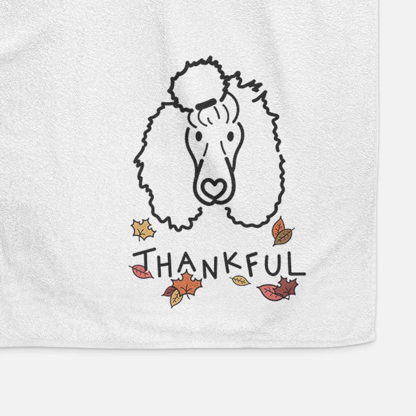 Minimalist line drawing of Jemma the Standard Poodle with 'Thankful' lettering on a decorative hand towel