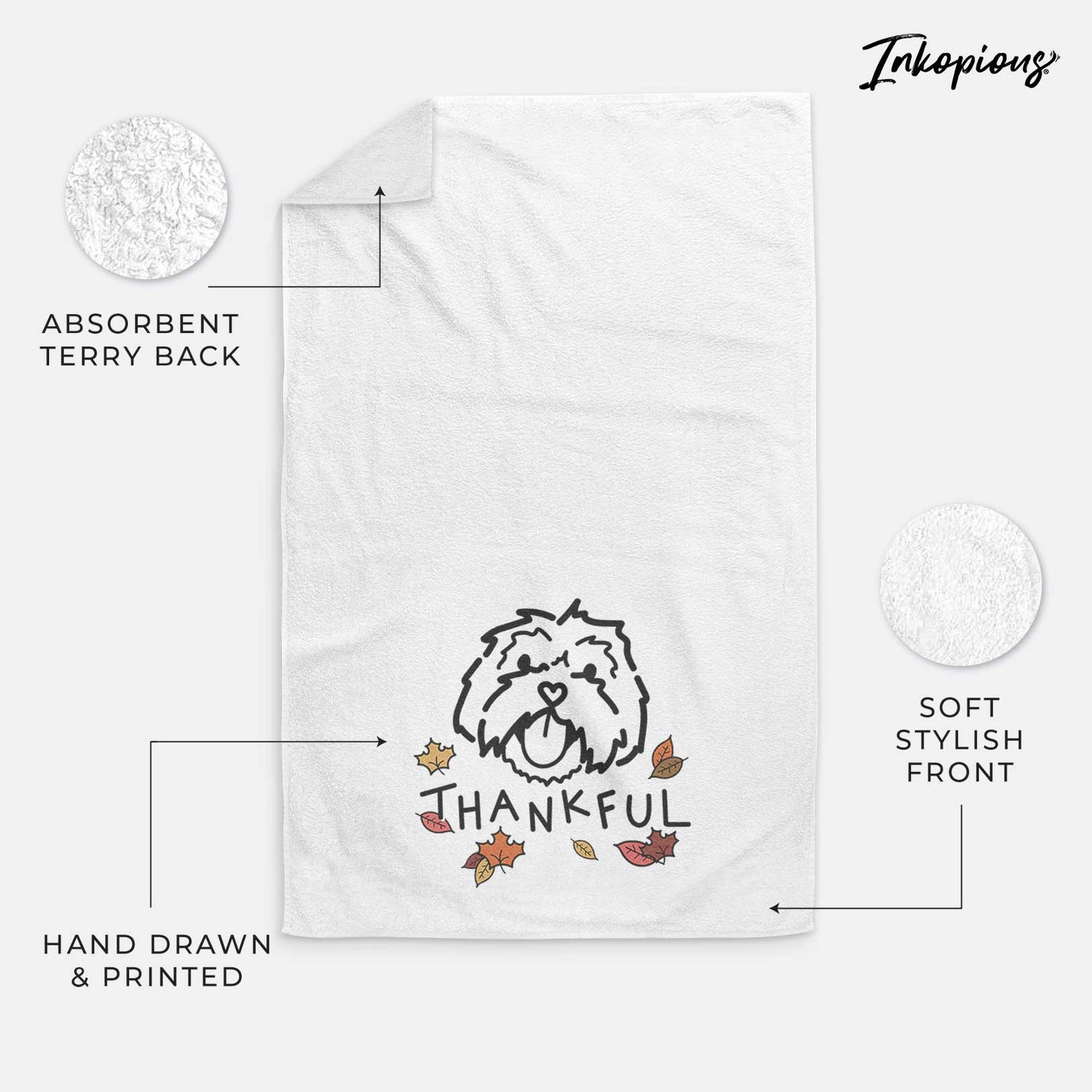 Minimalist line drawing of Keia the Lhasa Apso with 'Thankful' lettering on a decorative hand towel