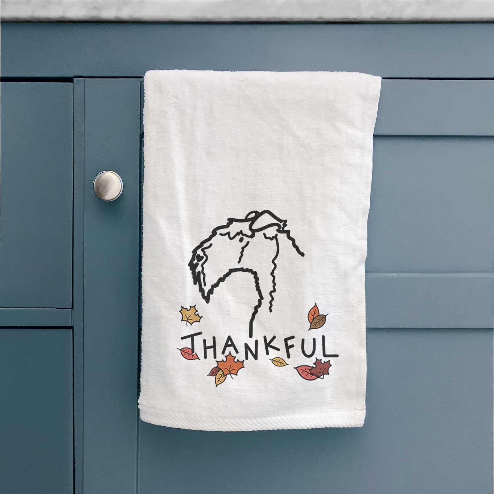 Minimalist line drawing of a Kerry Blue Terrier with 'Thankful' lettering on a decorative hand towel