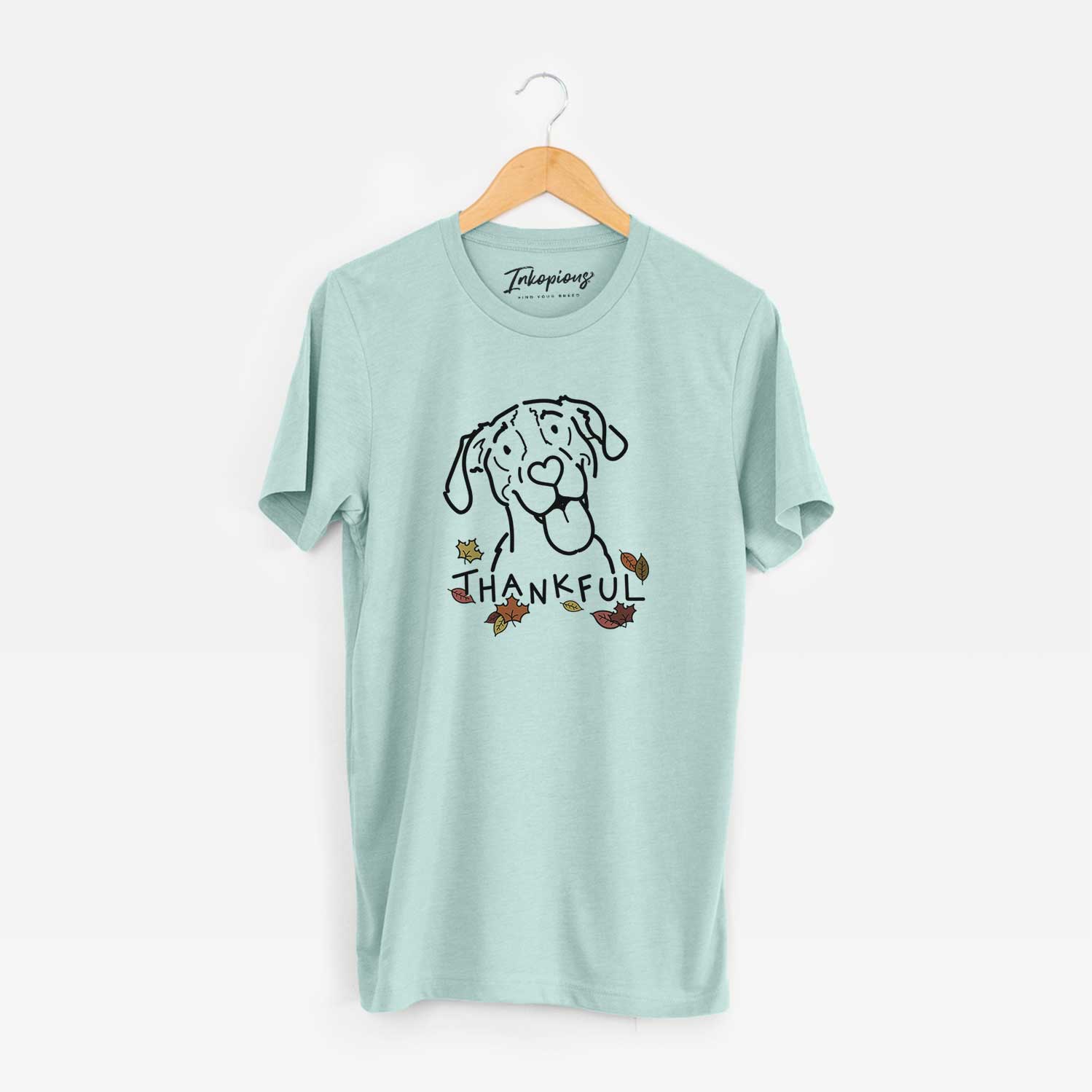 Minimalist line drawing of Kimble the Treeing Walker Coonhound with 'Thankful' lettering on a Heather Sage Unisex crewneck