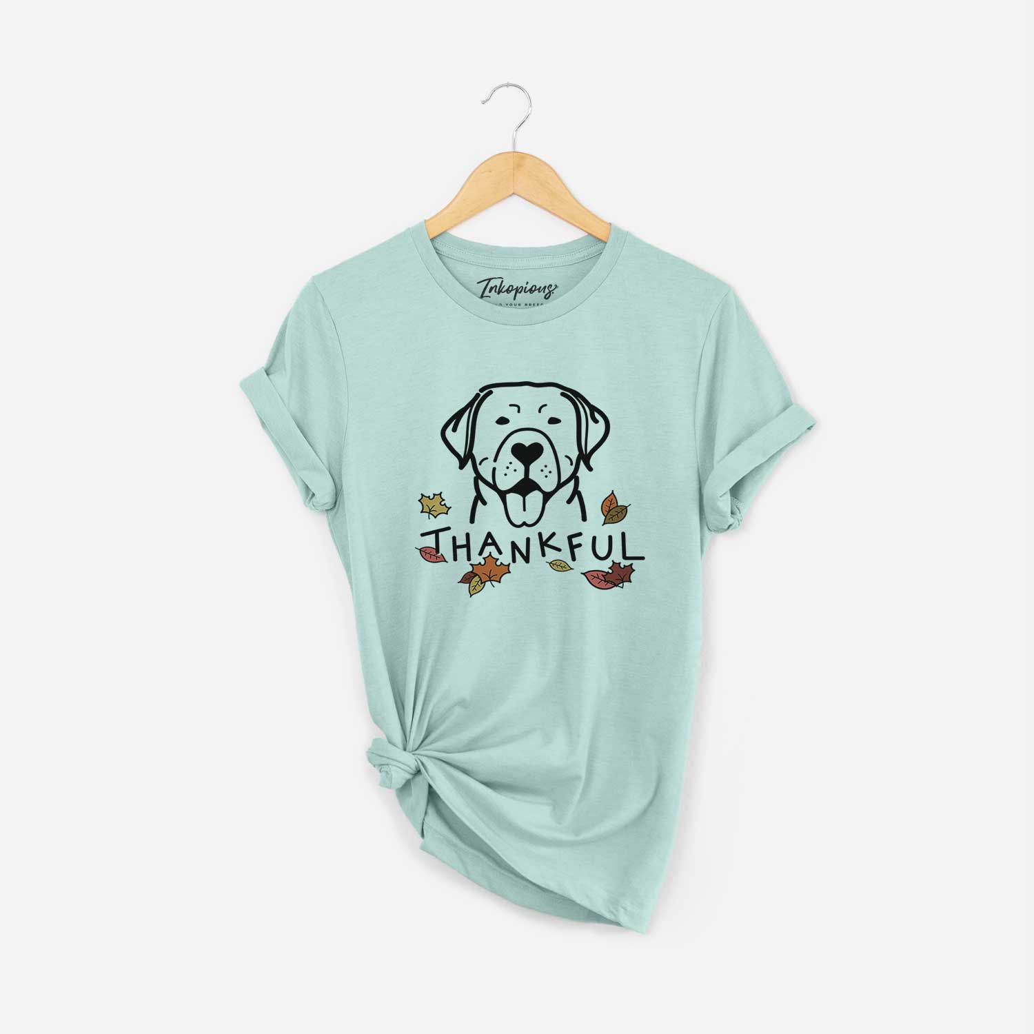 Minimalist line drawing of a Labrador Retriever with 'Thankful' lettering on a Heather Sage Unisex crewneck