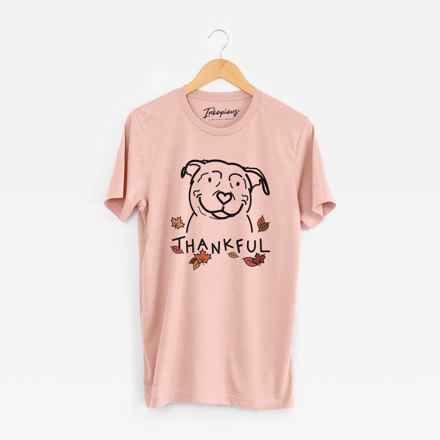 Minimalist line drawing of Lady the American Pitbull Terrier with 'Thankful' lettering on a Peach Unisex crewneck
