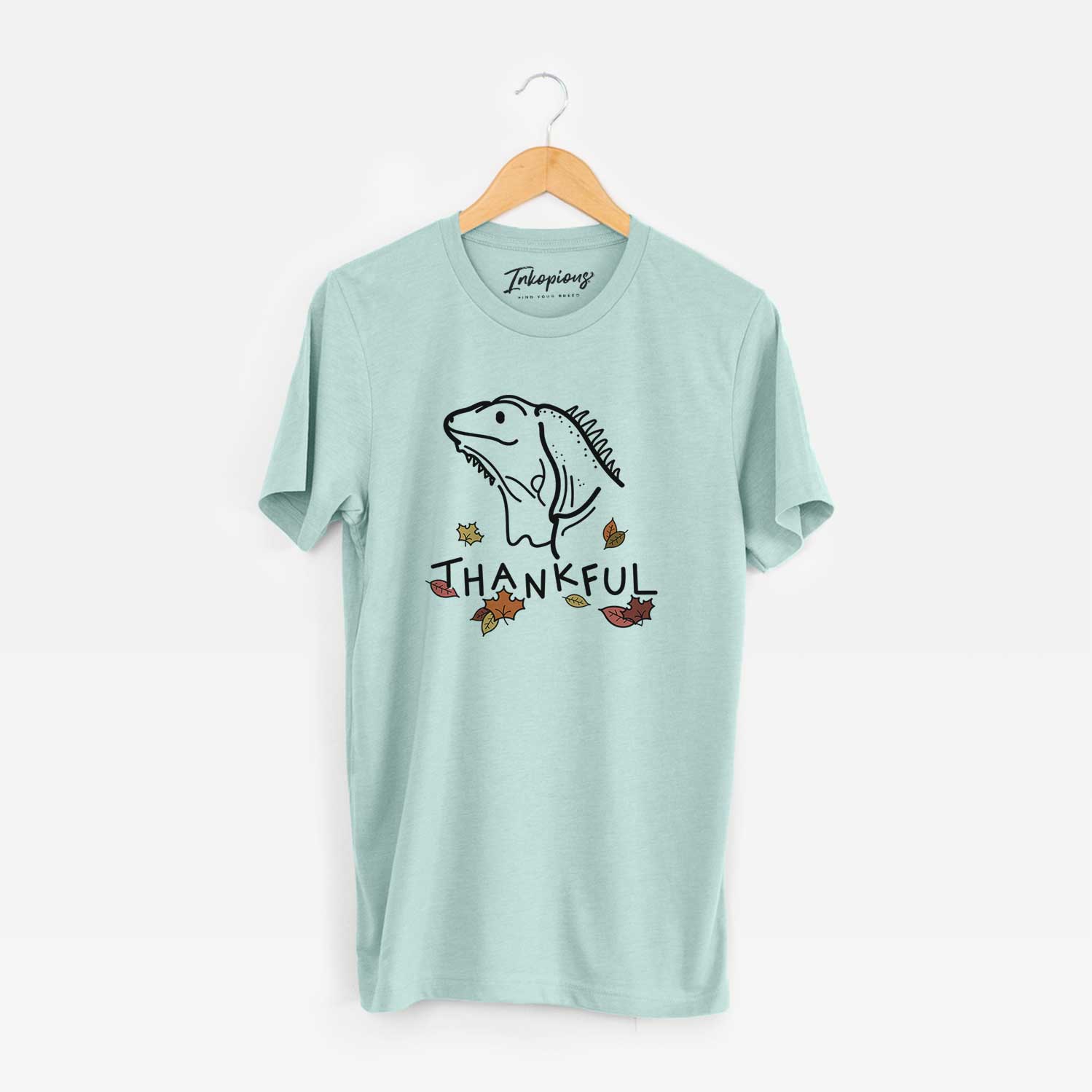 Minimalist line drawing of Louie the Iguana with 'Thankful' lettering on a Heather Sage Unisex crewneck