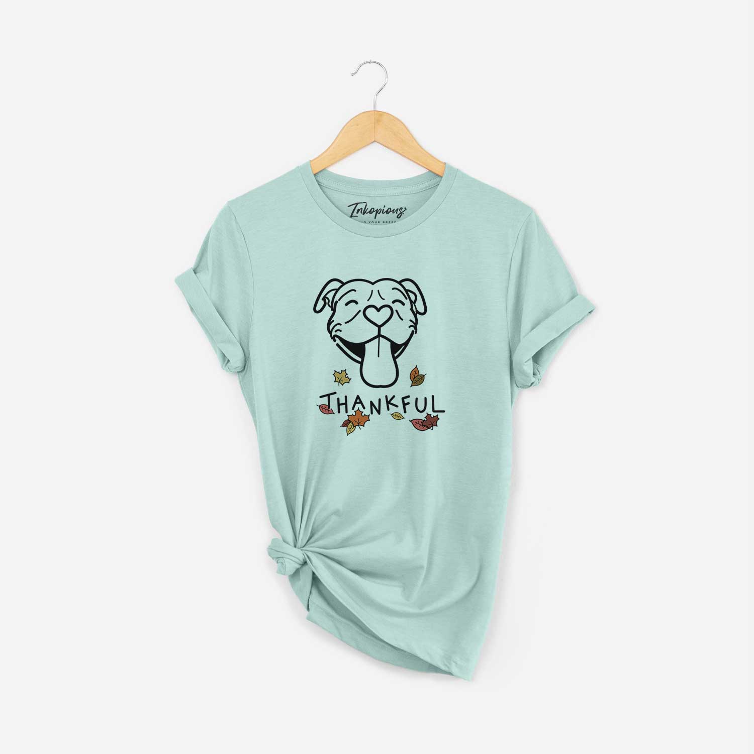 Minimalist line drawing of Louie the Pitbull with 'Thankful' lettering on a Heather Sage Unisex crewneck