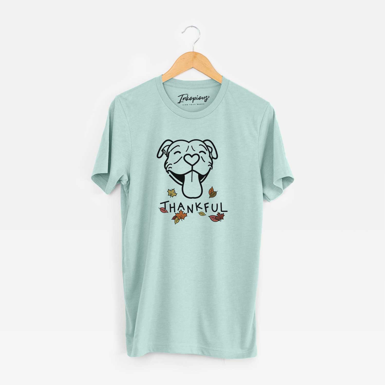 Minimalist line drawing of Louie the Pitbull with 'Thankful' lettering on a Heather Sage Unisex crewneck