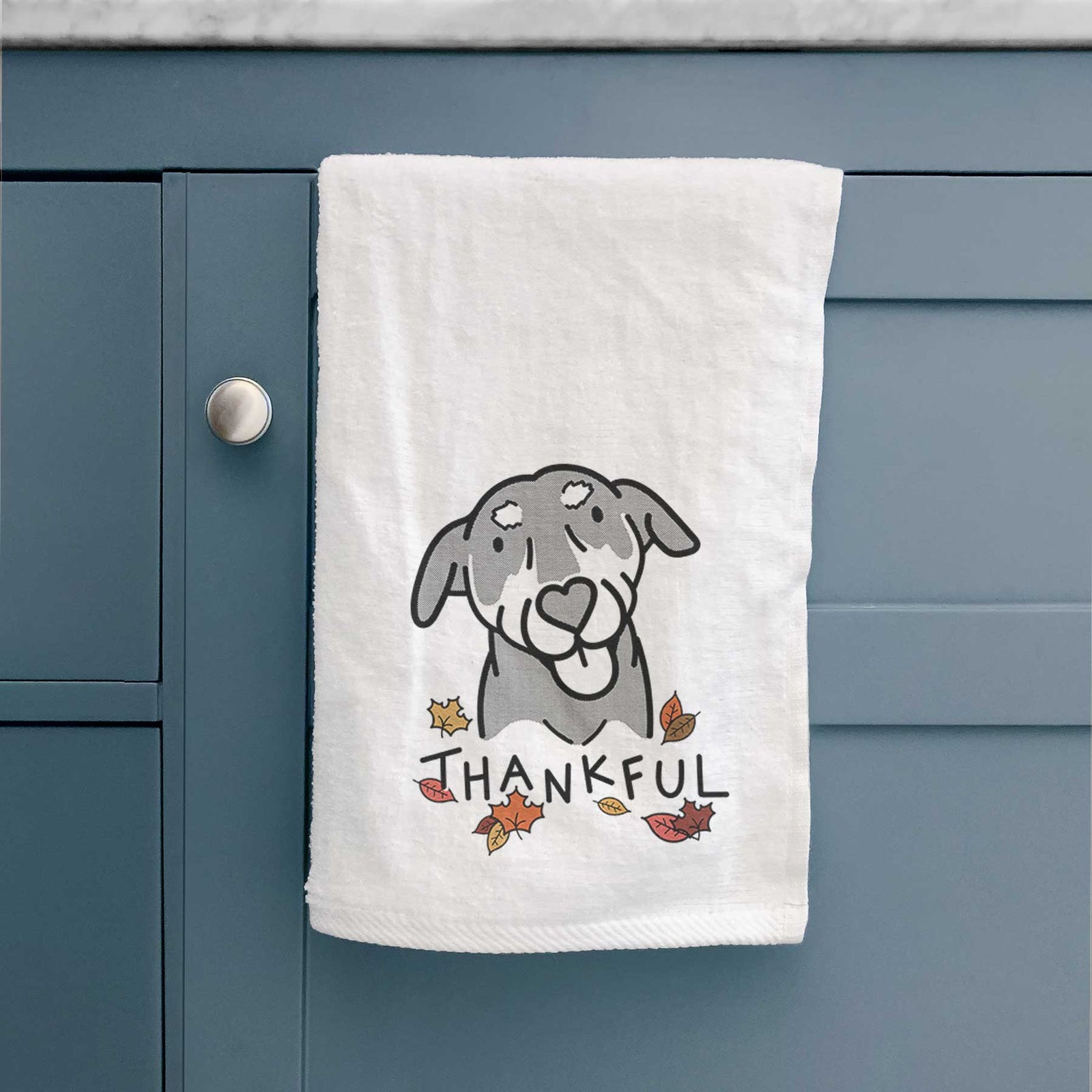 Minimalist line drawing of Lousia the Mixed Breed with 'Thankful' lettering on a decorative hand towel