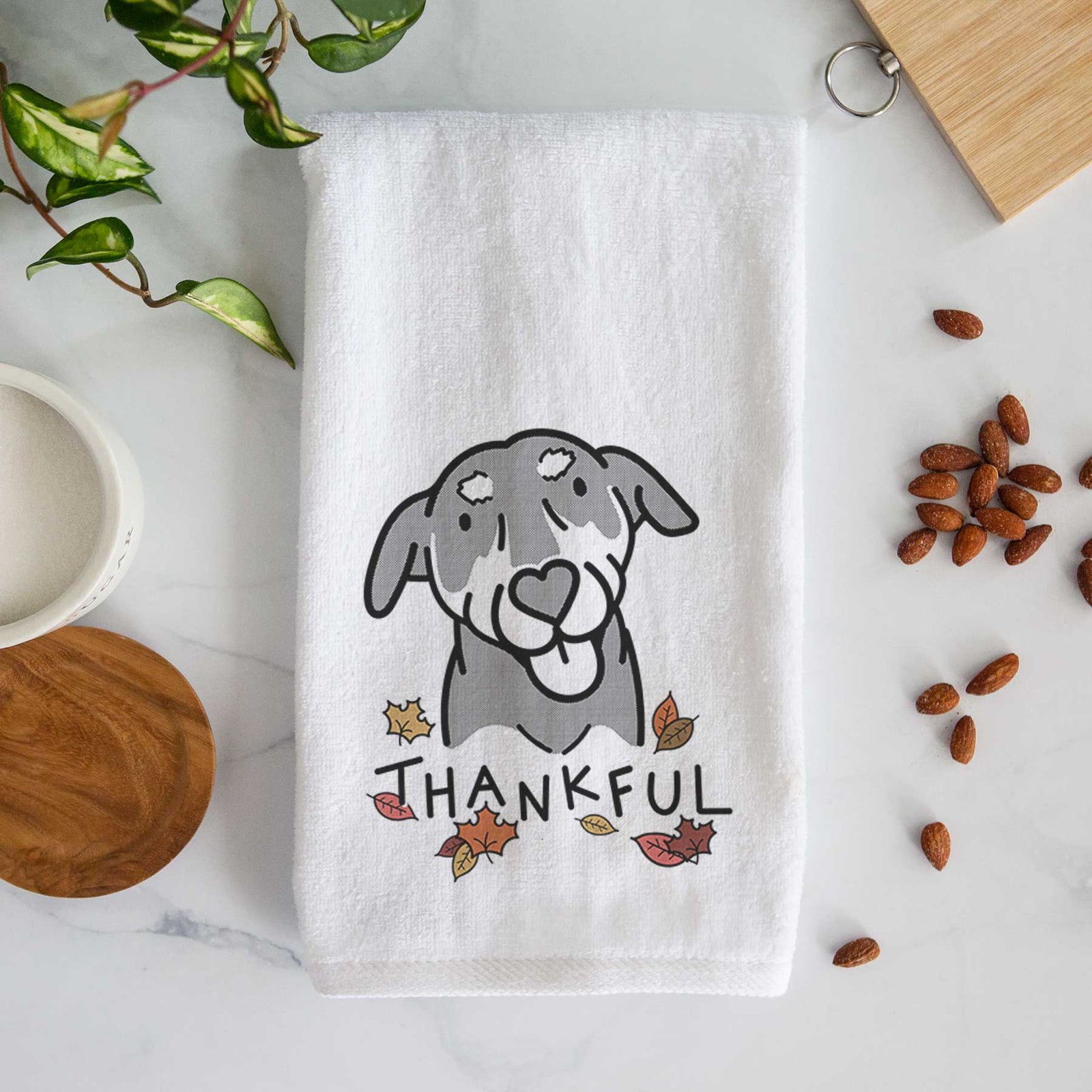 Minimalist line drawing of Lousia the Mixed Breed with 'Thankful' lettering on a decorative hand towel