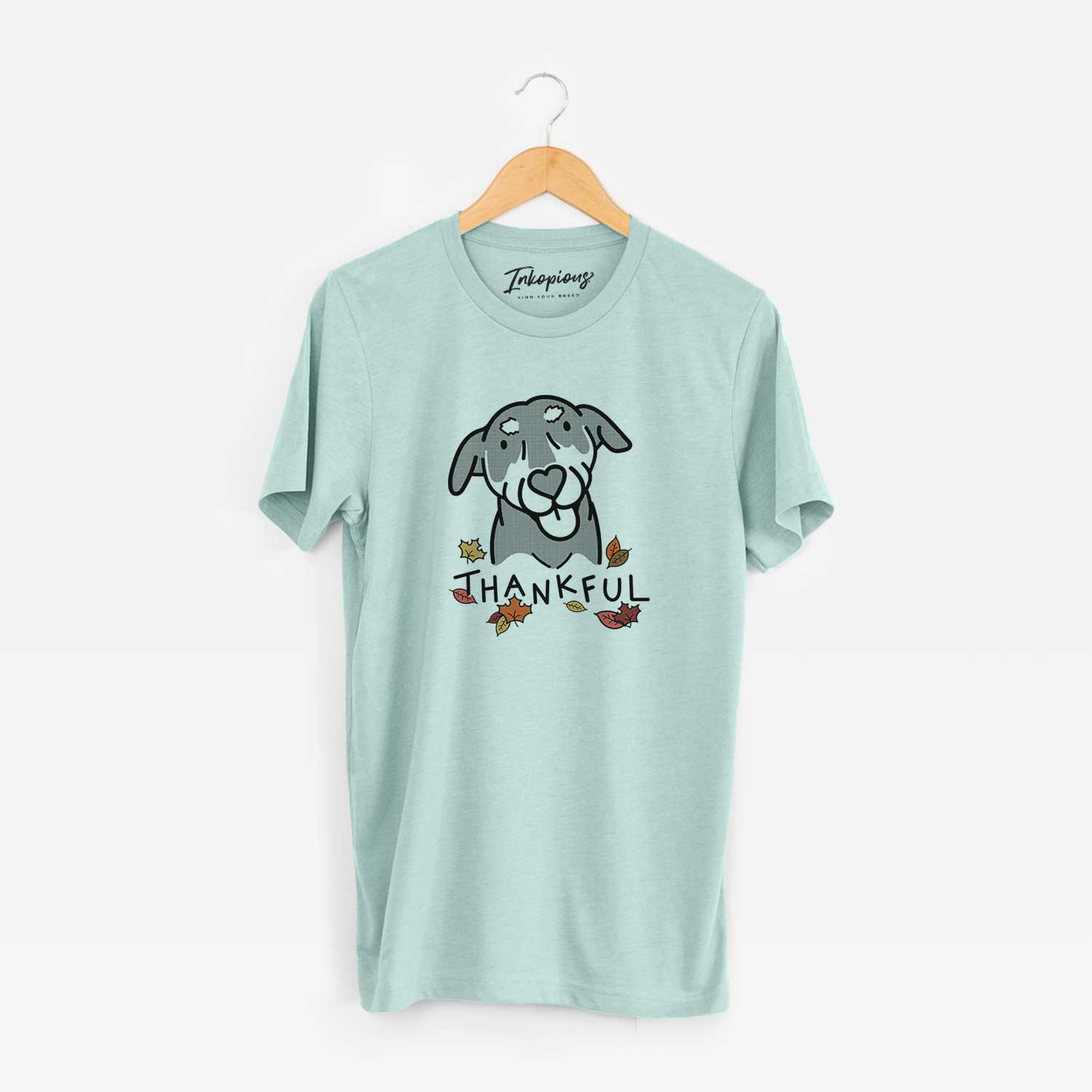 Minimalist line drawing of Lousia the Mixed Breed with 'Thankful' lettering on a Heather Sage Unisex crewneck