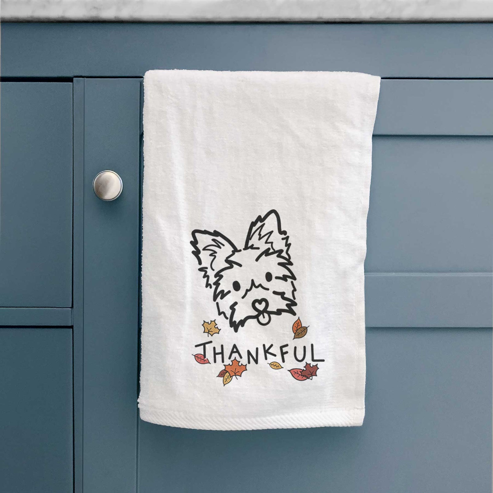 Minimalist line drawing of Luna the Yorkshire Terrier with 'Thankful' lettering on a decorative hand towel