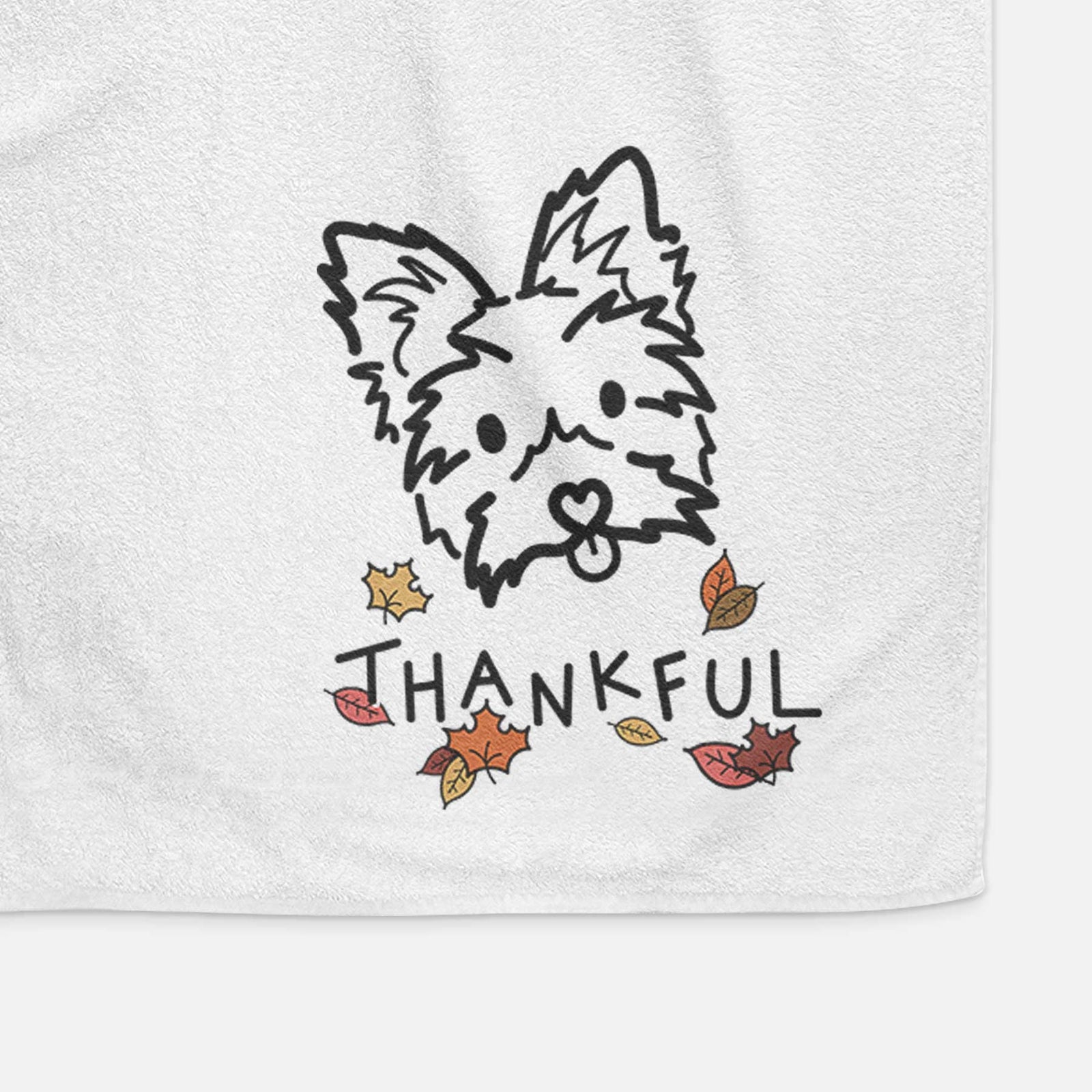 Minimalist line drawing of Luna the Yorkshire Terrier with 'Thankful' lettering on a decorative hand towel
