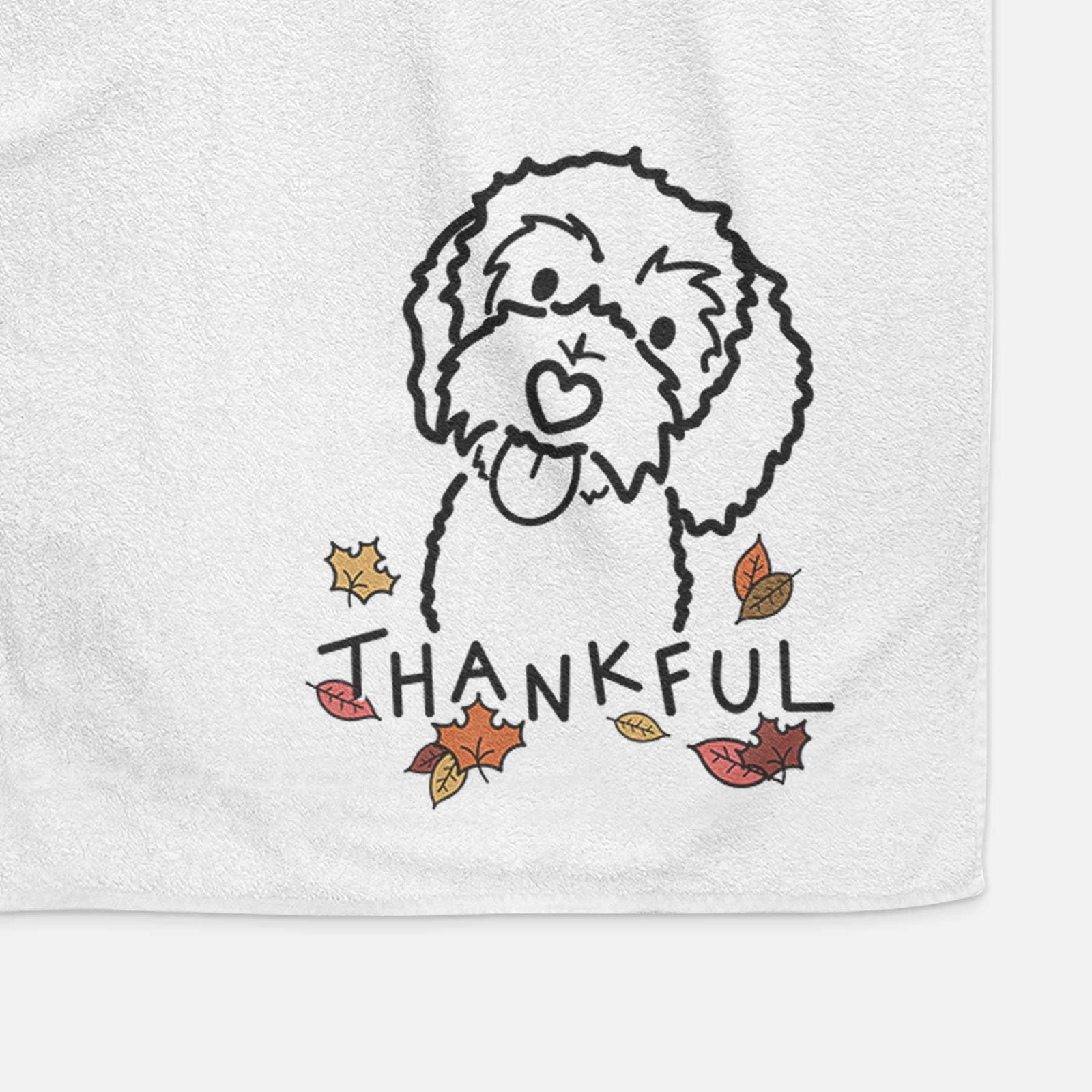 Minimalist line drawing of Mabel the Bernedoodle with 'Thankful' lettering on a decorative hand towel