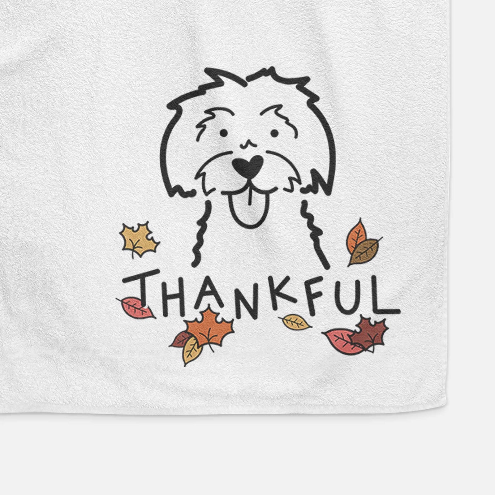 Minimalist line drawing of a Maltese with 'Thankful' lettering on a decorative hand towel