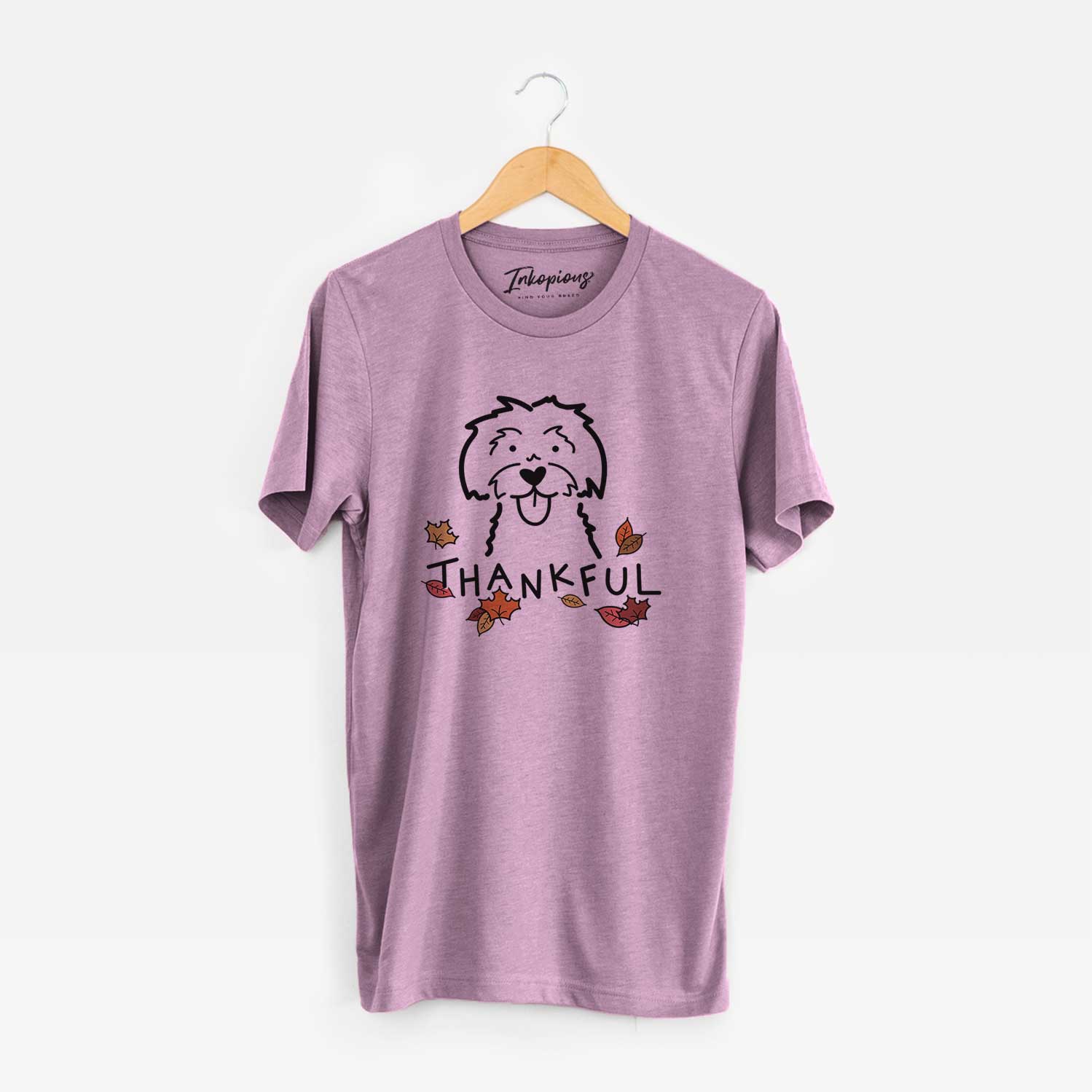 Minimalist line drawing of a Maltese with 'Thankful' lettering on an Orchid Unisex crewneck