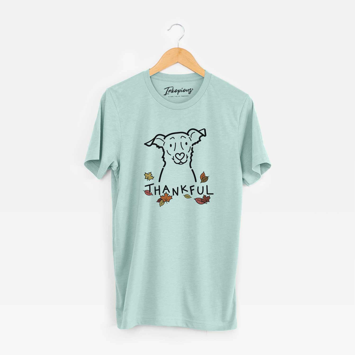 Minimalist line drawing of Millie the Border Collie Mix with 'Thankful' lettering on a Heather Sage Unisex crewneck