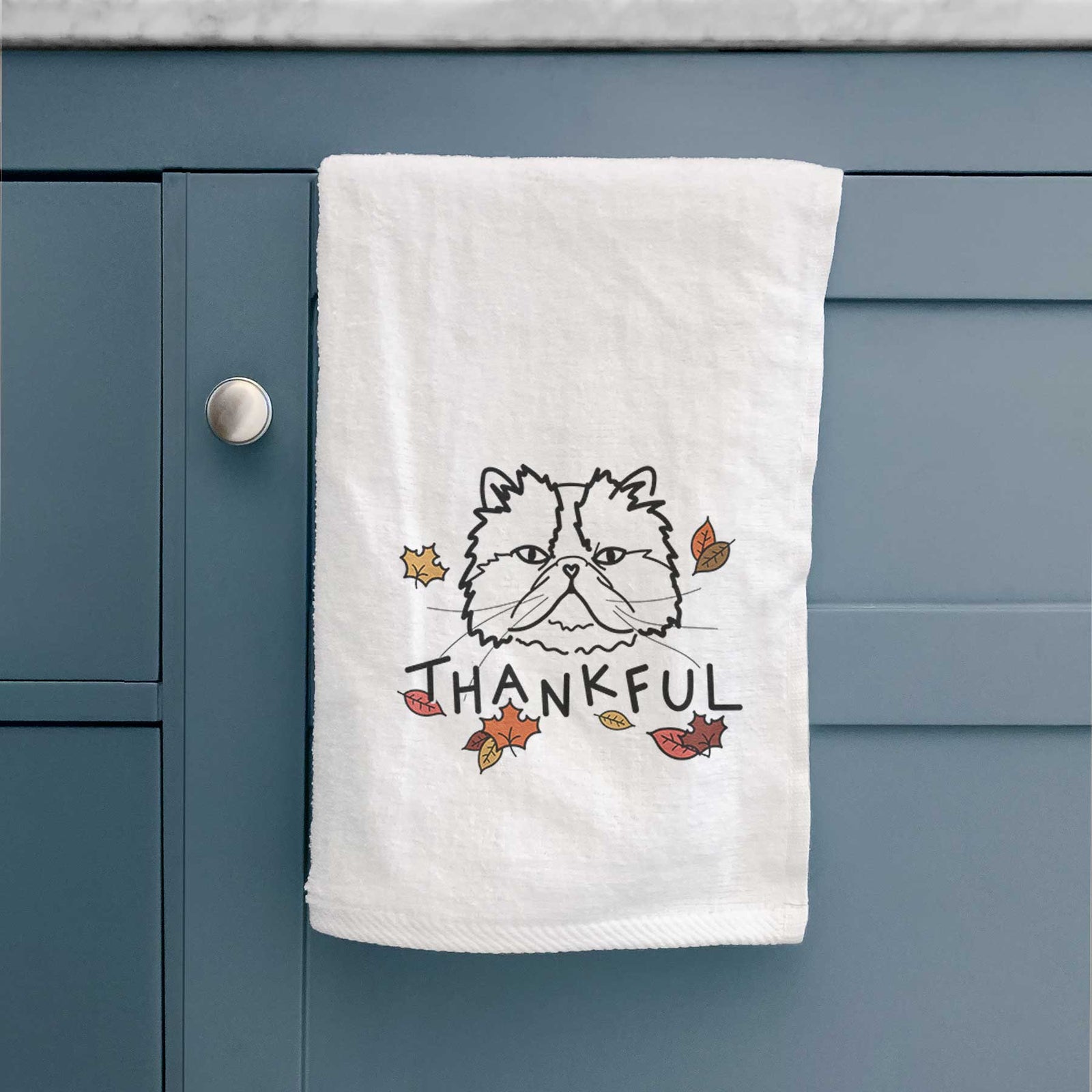 Minimalist line drawing of Mila the Persian Cat with 'Thankful' lettering on a decorative hand towel
