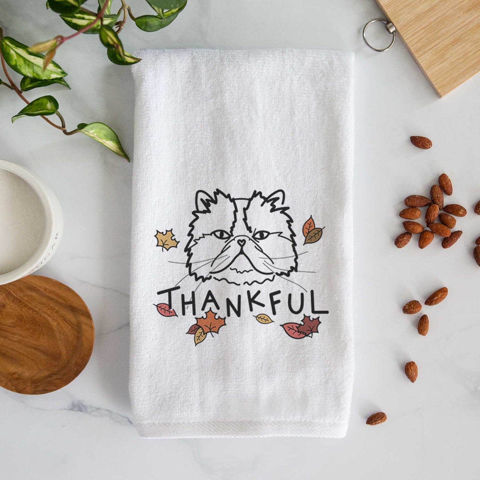 Minimalist line drawing of Mila the Persian Cat with 'Thankful' lettering on a decorative hand towel