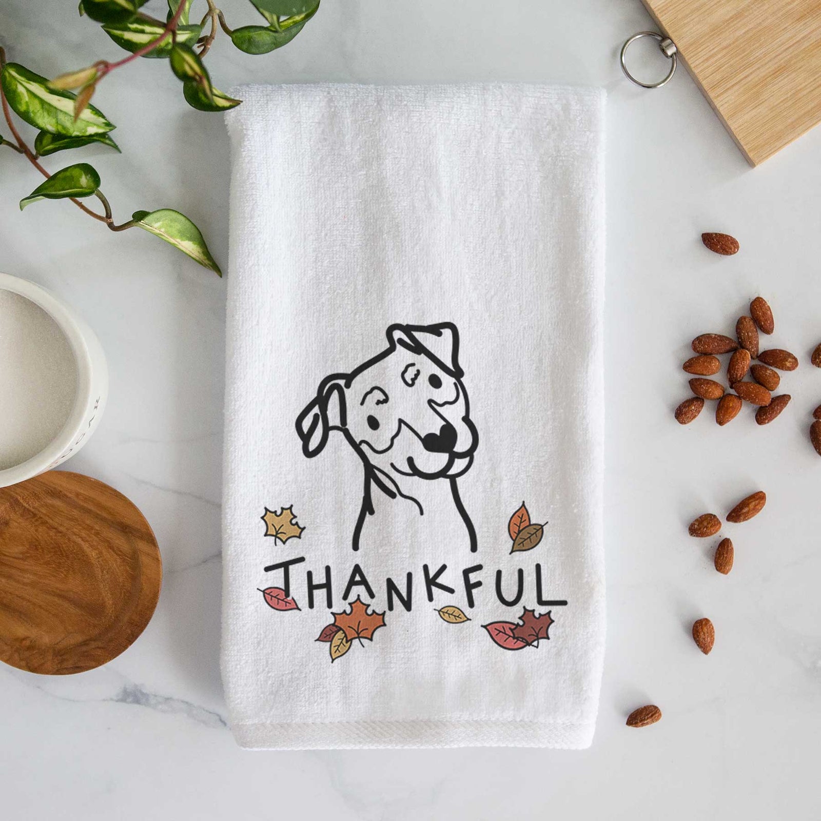 Minimalist line drawing of a Mini Pinscher with 'Thankful' lettering on a decorative hand towel