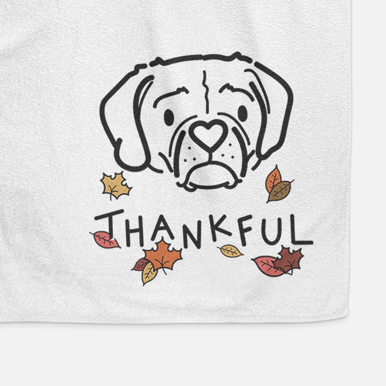 Minimalist line drawing of Mitzi the Puggle with 'Thankful' lettering on a decorative hand towel