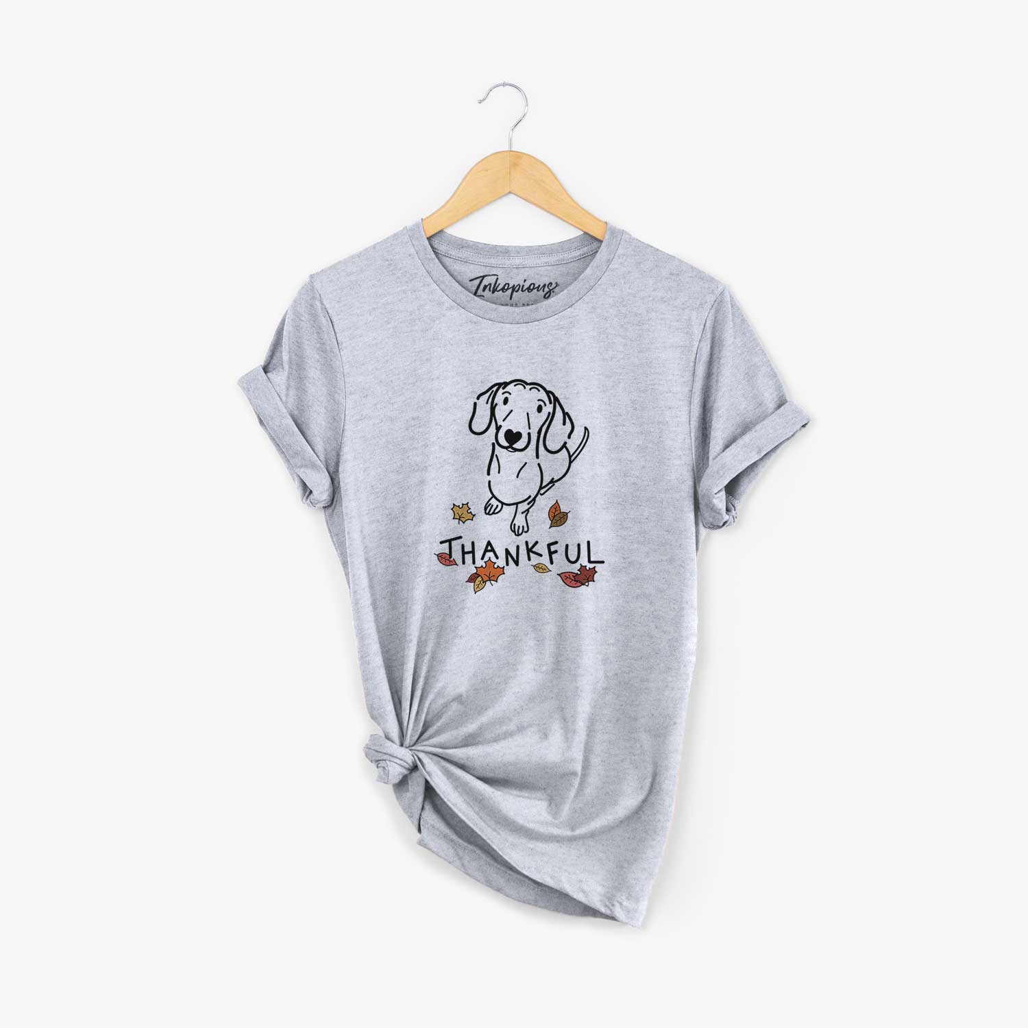 Minimalist line drawing of Moxie the Dachshund with 'Thankful' lettering on a Grey Unisex crewneck