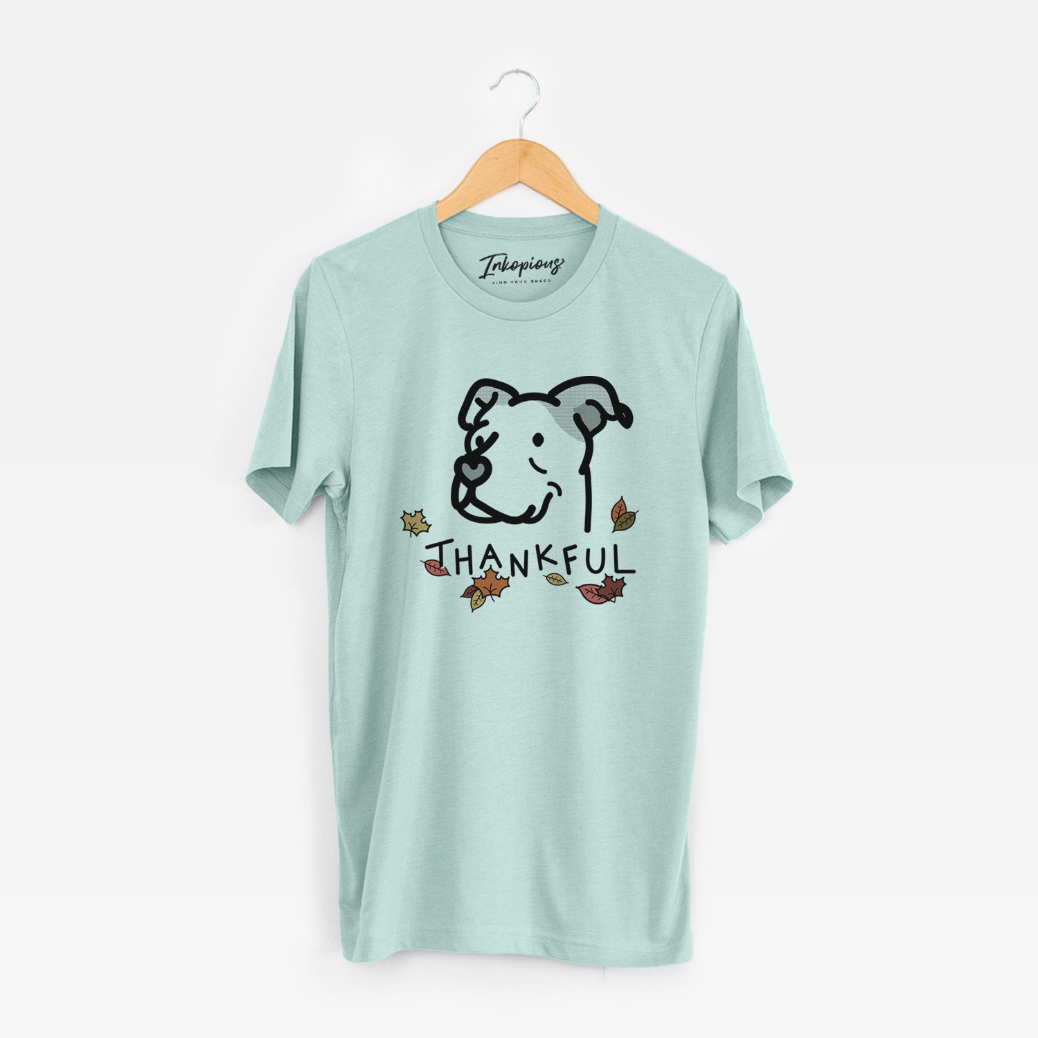 Minimalist line drawing of Mr. Sir the Pitbull Mix with 'Thankful' lettering on a Heather Sage Unisex crewneck