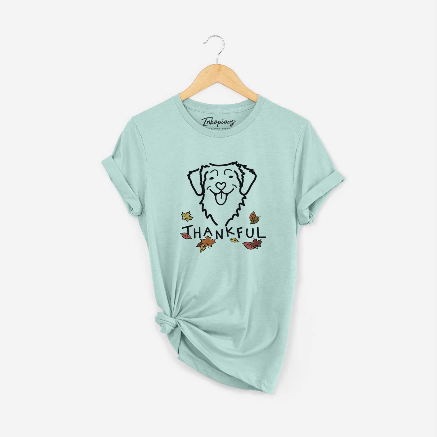 Minimalist line drawing of a Nova Scotia Duck Tolling Retriever with 'Thankful' lettering on a Heather Sage Unisex crewneck