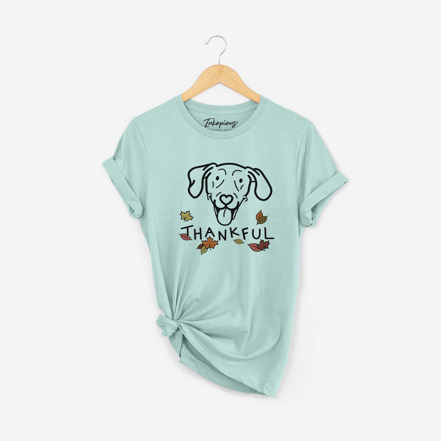 Minimalist line drawing of Paco Lobo the Weimaraner with 'Thankful' lettering on a Heather Sage Unisex crewneck