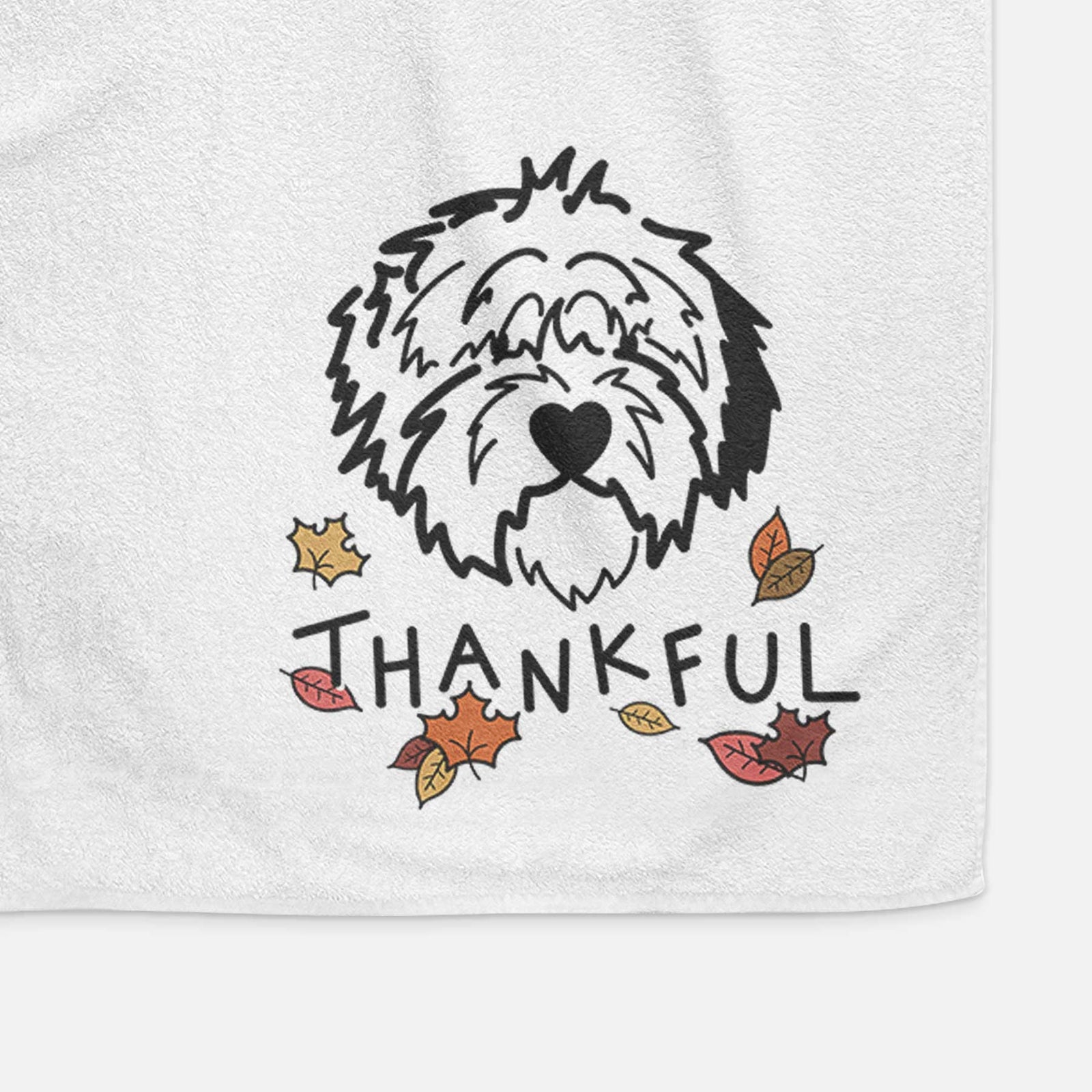 Minimalist line drawing of Penny the Old English Sheepdog with 'Thankful' lettering on a decorative hand towel