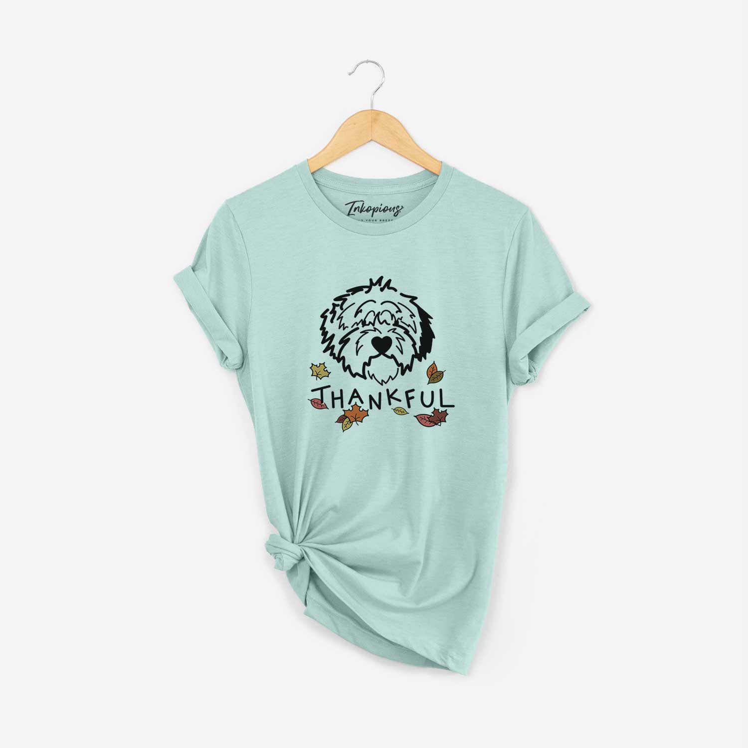 Minimalist line drawing of Penny the Old English Sheepdog with 'Thankful' lettering on a Heather Sage Unisex crewneck