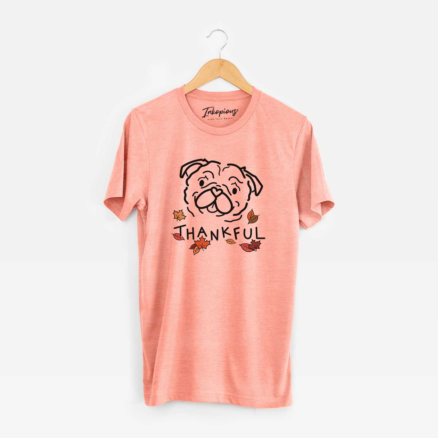 Minimalist line drawing of Pip the Pug with 'Thankful' lettering on a Sunset Unisex crewneck