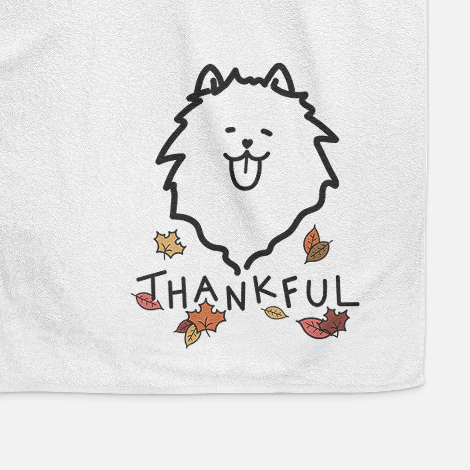 Minimalist line drawing of a Pomeranian with 'Thankful' lettering on a decorative hand towel