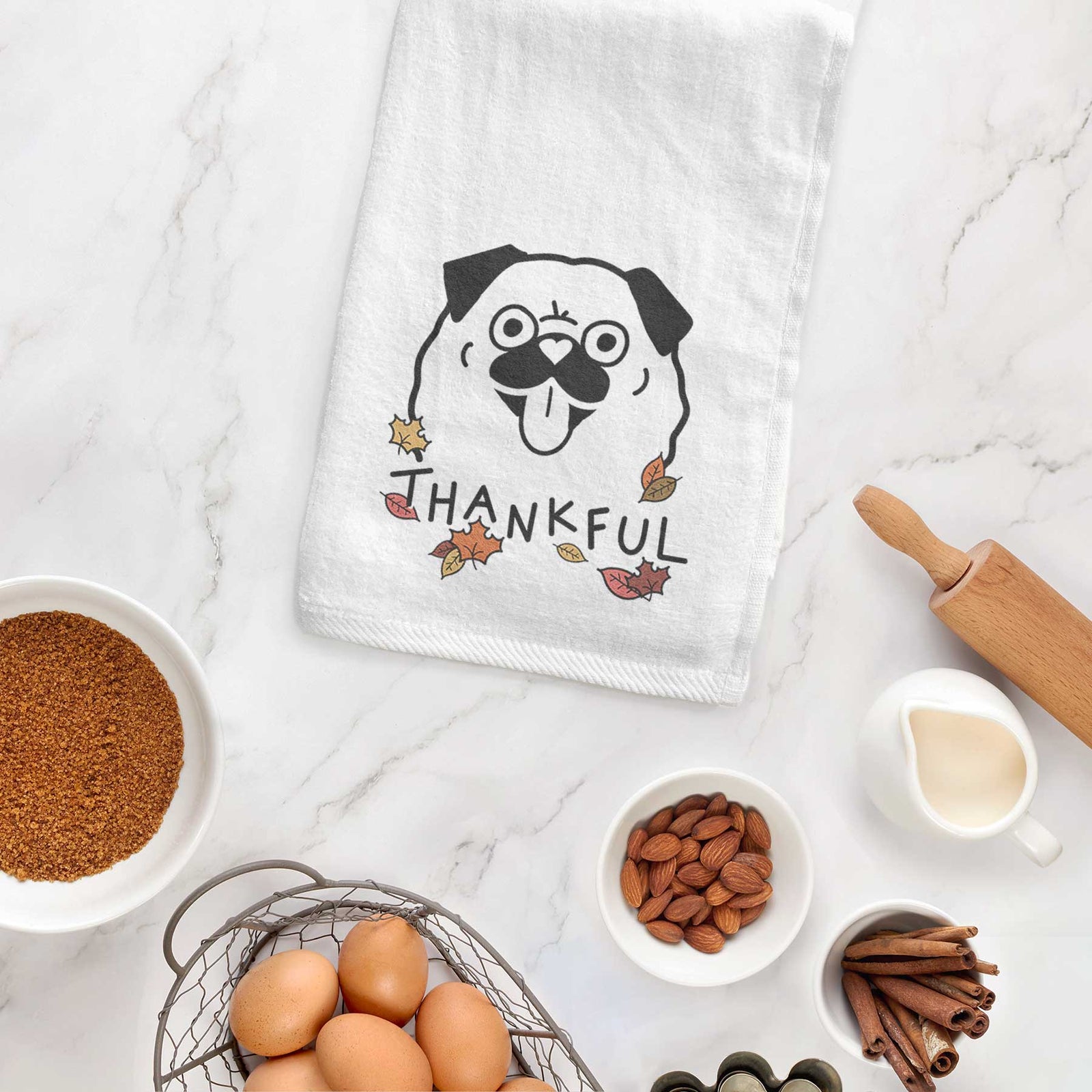 Minimalist line drawing of a Pug with 'Thankful' lettering on a decorative hand towel