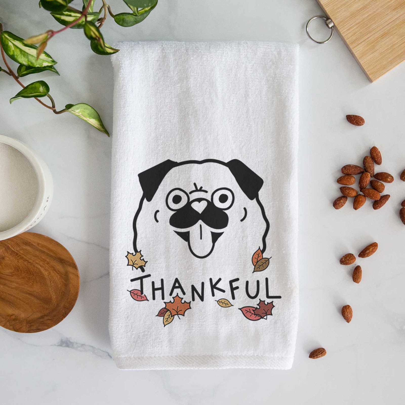 Minimalist line drawing of a Pug with 'Thankful' lettering on a decorative hand towel