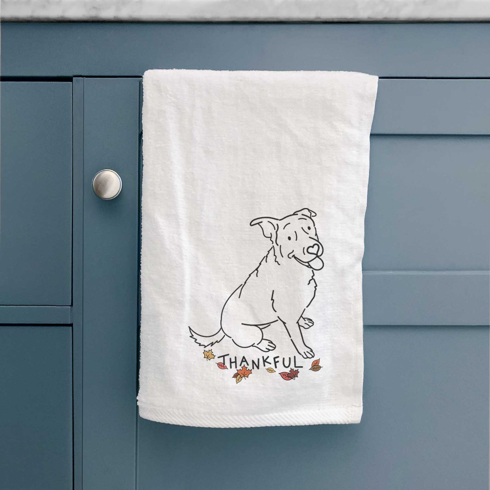 Minimalist line drawing of Rocky the Rottweiler Mix with 'Thankful' lettering on a decorative hand towel
