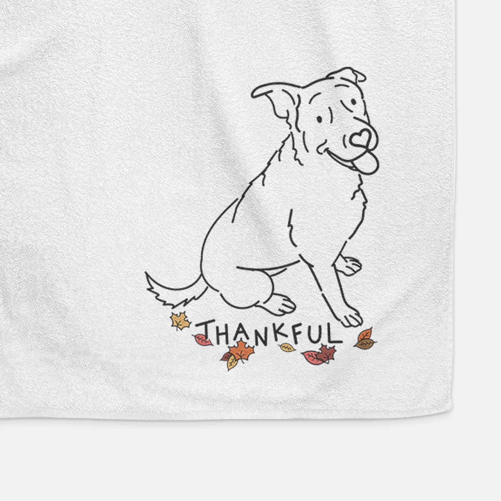 Minimalist line drawing of Rocky the Rottweiler Mix with 'Thankful' lettering on a decorative hand towel