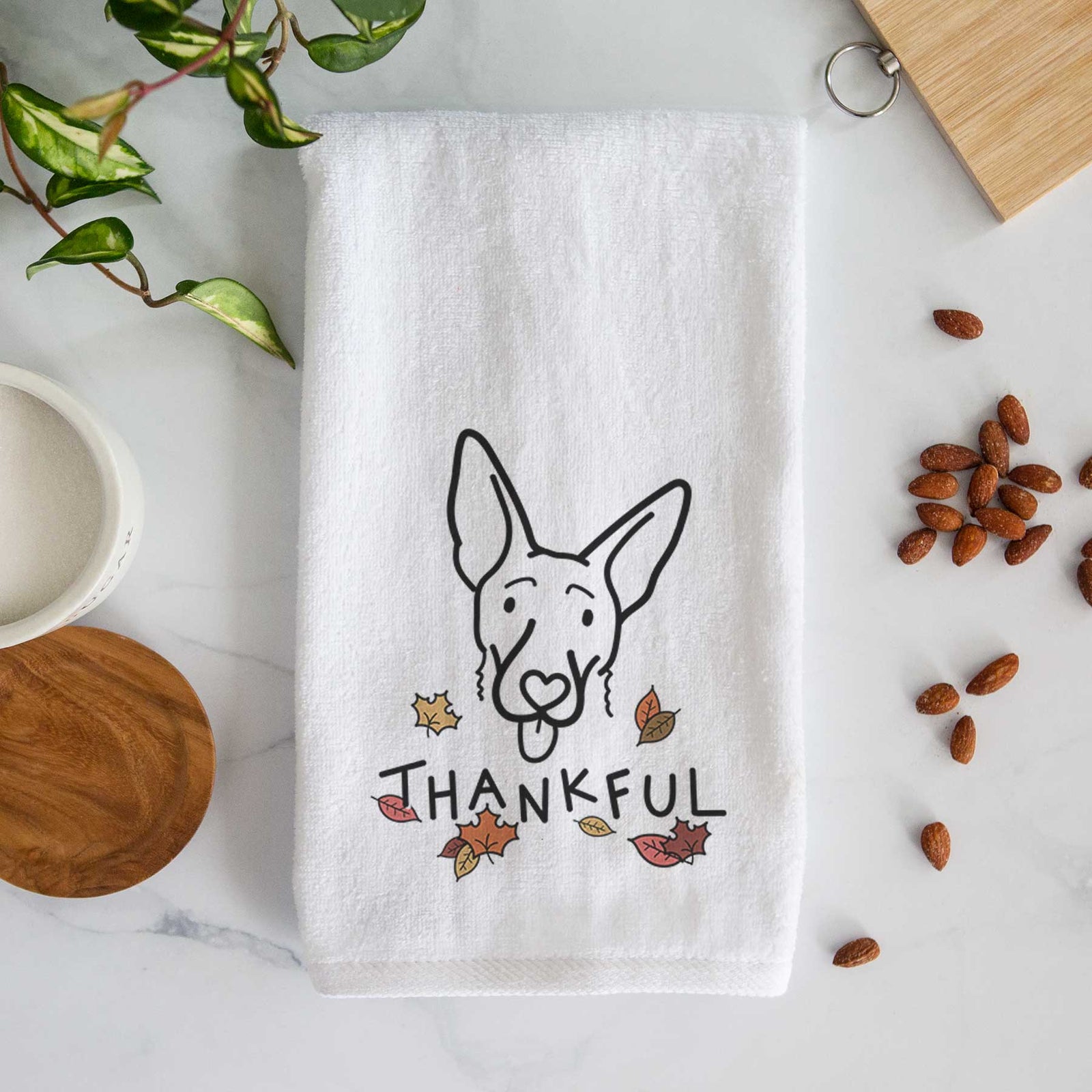 Minimalist line drawing of Rosie the Shepherd Mix with 'Thankful' lettering on a decorative hand towel