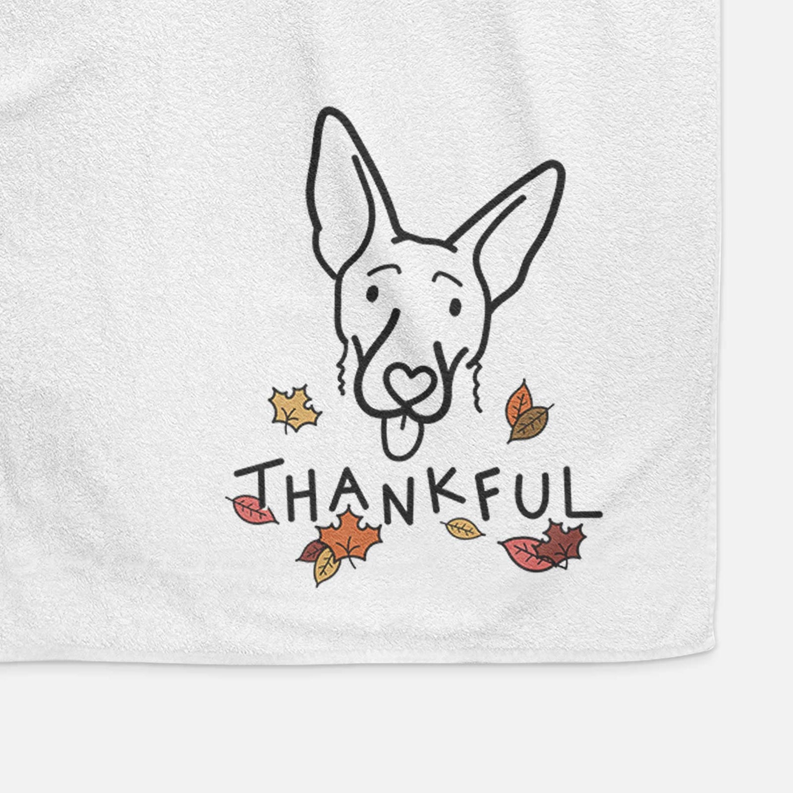 Minimalist line drawing of Rosie the Shepherd Mix with 'Thankful' lettering on a decorative hand towel