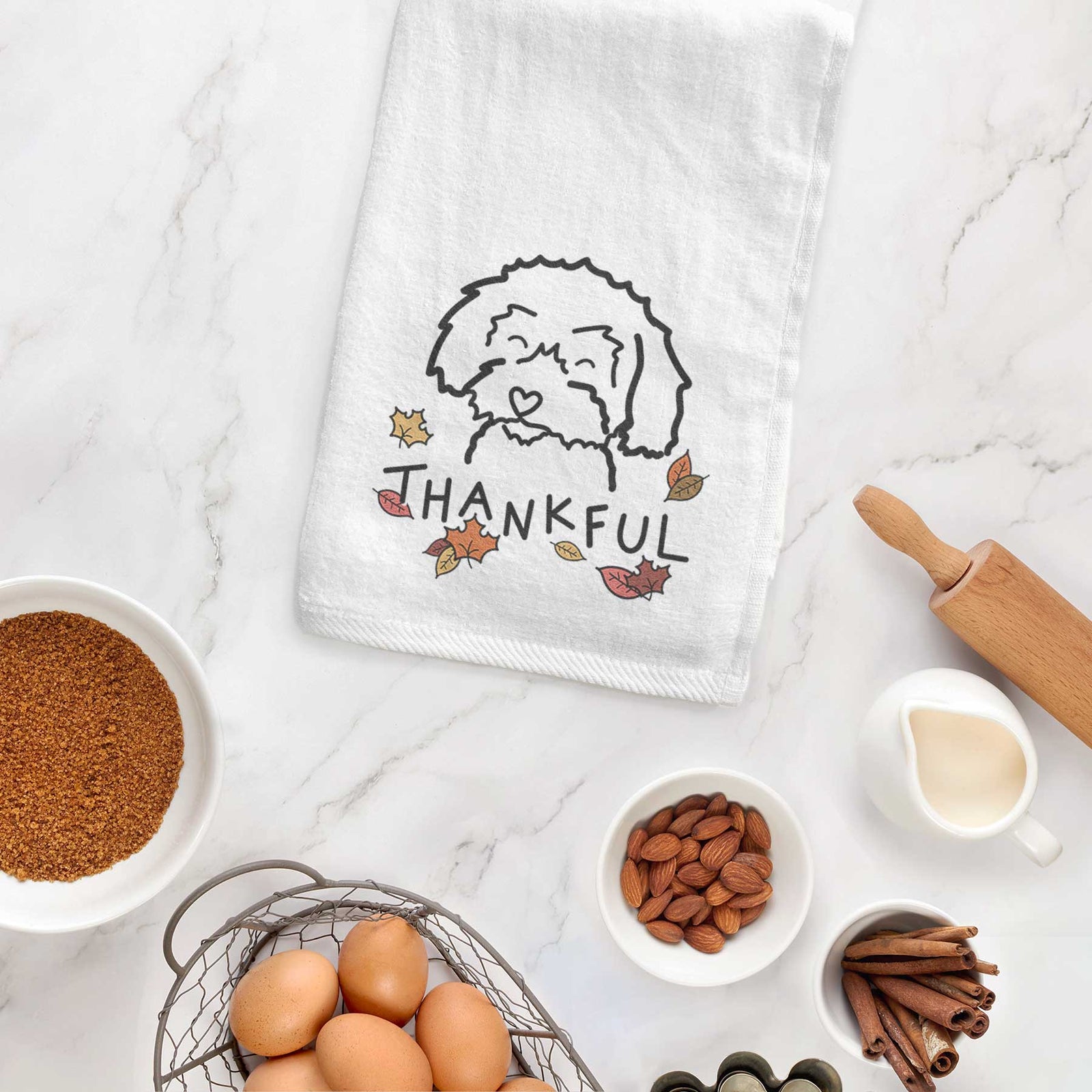 Minimalist line drawing of a Schnoodle with 'Thankful' lettering on a decorative hand towel