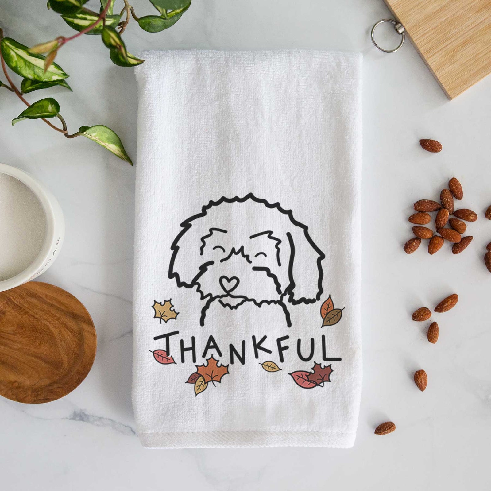 Minimalist line drawing of a Schnoodle with 'Thankful' lettering on a decorative hand towel