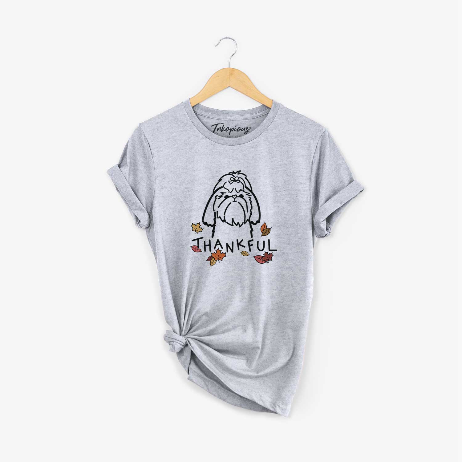 Minimalist line drawing of a Shih Tzu with 'Thankful' lettering on a Grey Unisex crewneck