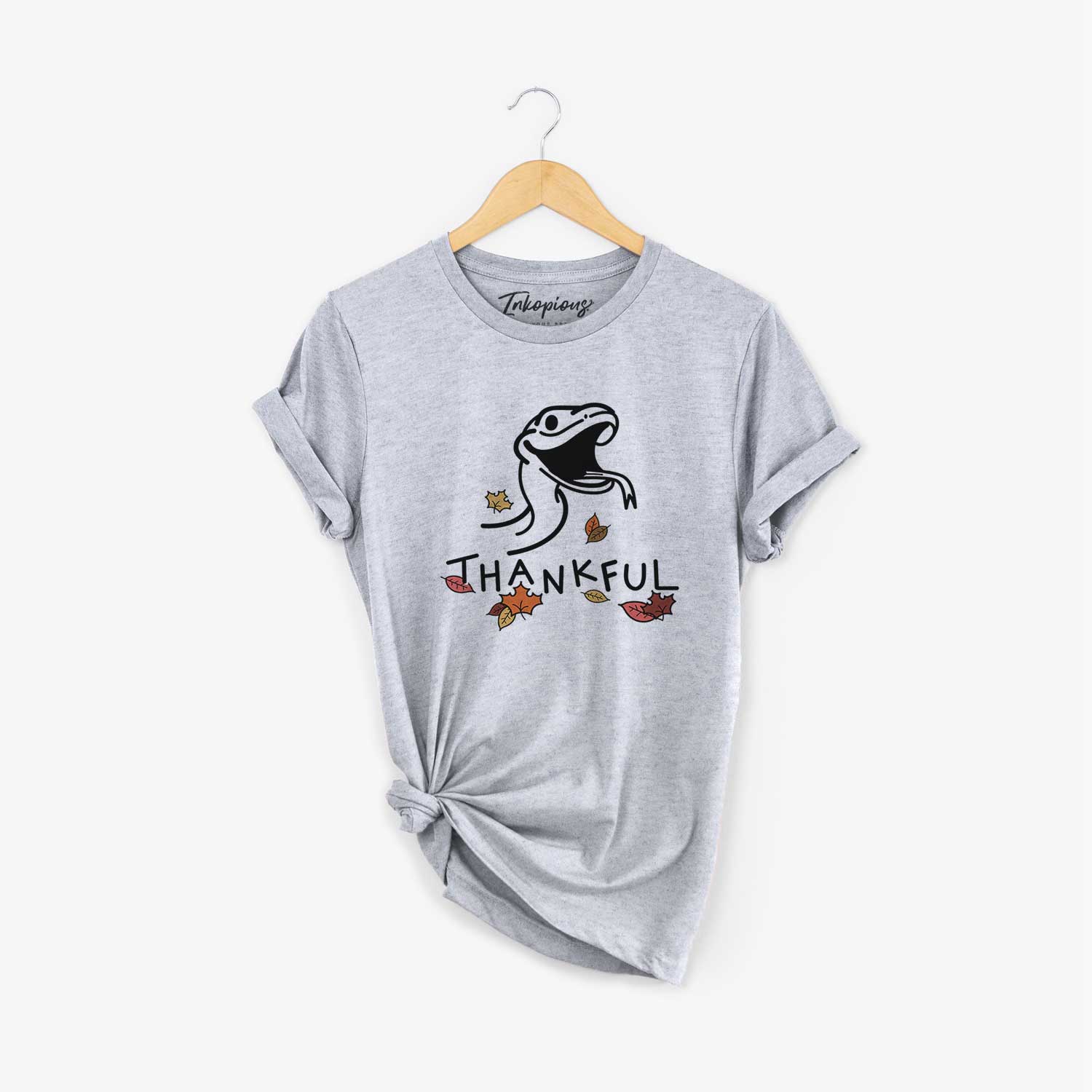 Minimalist line drawing of Spike the Snake with 'Thankful' lettering on a Grey Unisex crewneck