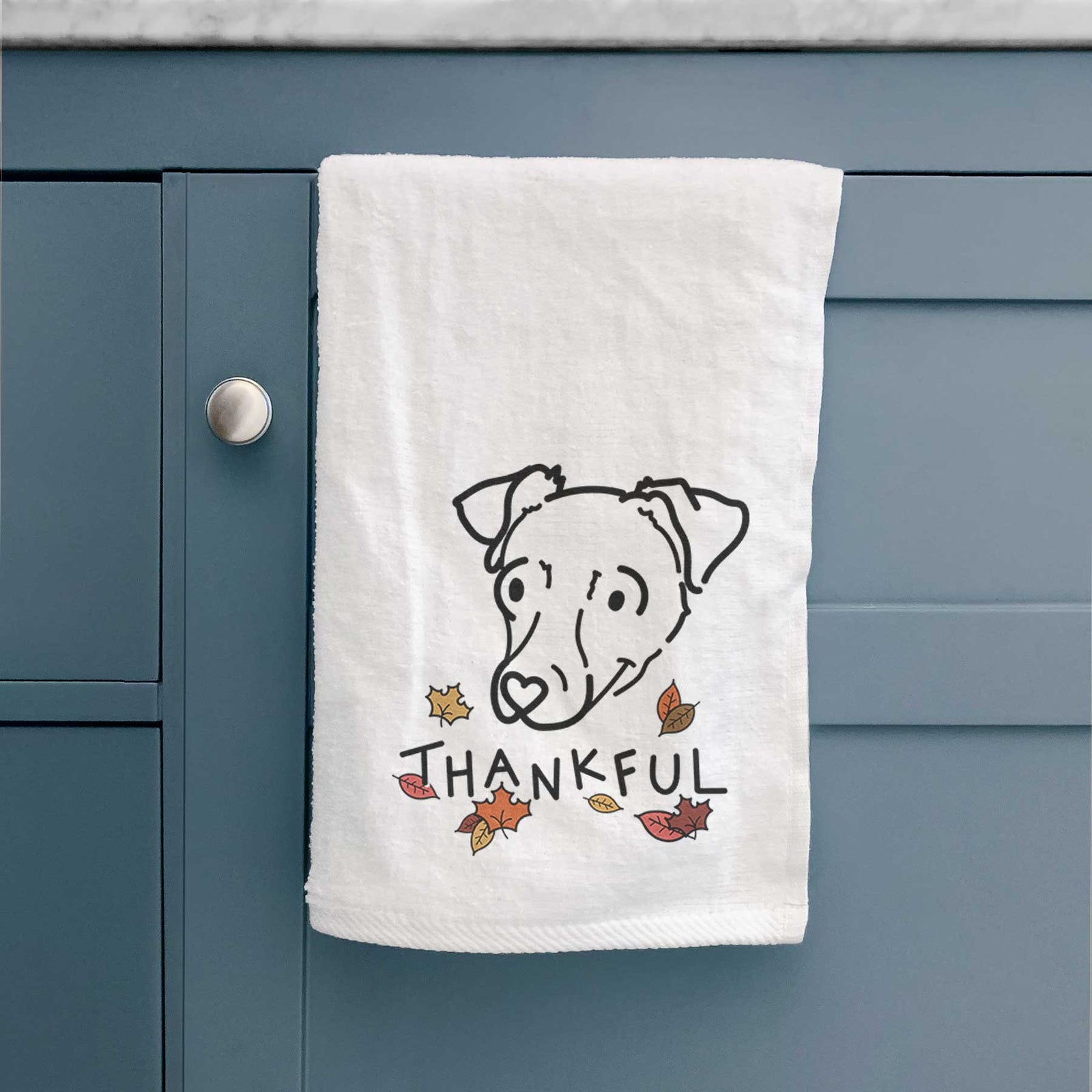 Minimalist line drawing of Tater Tot the Chiweenie with 'Thankful' lettering on a decorative hand towel
