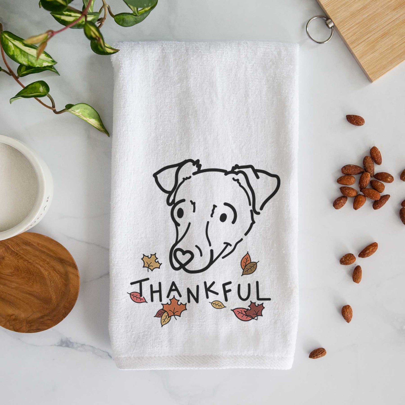 Minimalist line drawing of Tater Tot the Chiweenie with 'Thankful' lettering on a decorative hand towel