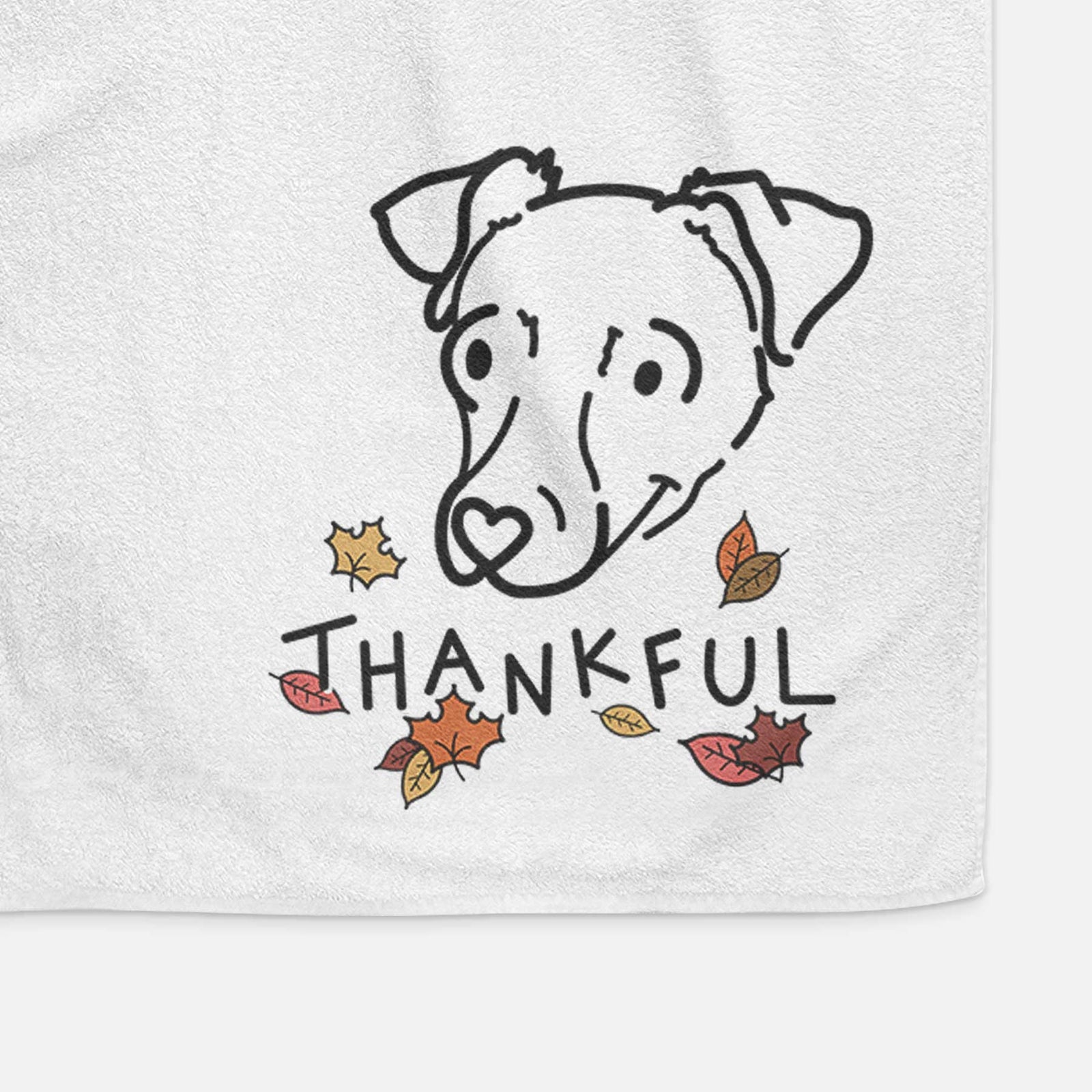 Minimalist line drawing of Tater Tot the Chiweenie with 'Thankful' lettering on a decorative hand towel