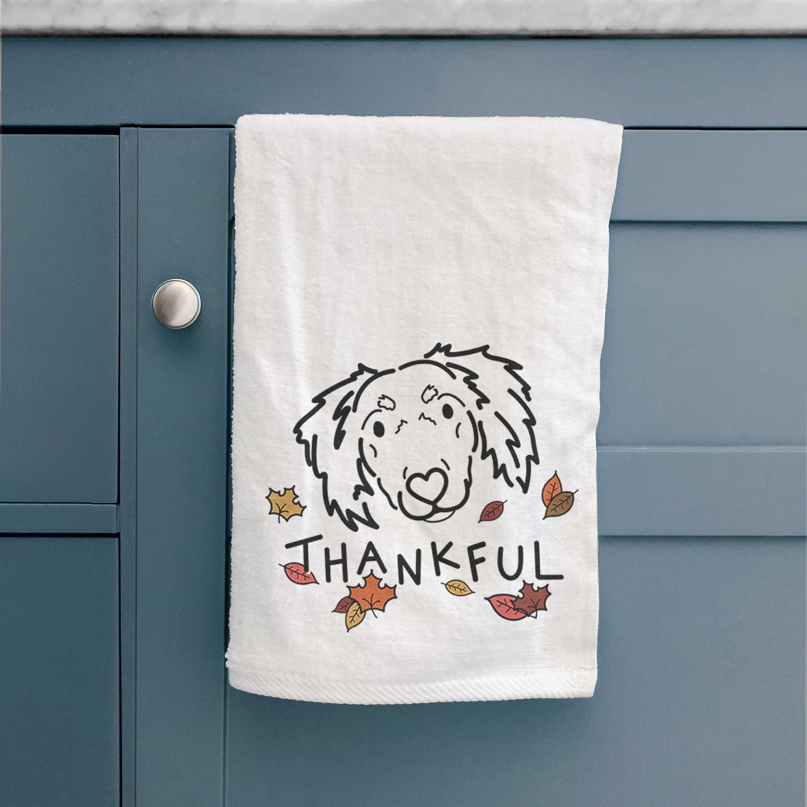 Minimalist line drawing of Tilly the Dachshund Mix with 'Thankful' lettering on a decorative hand towel