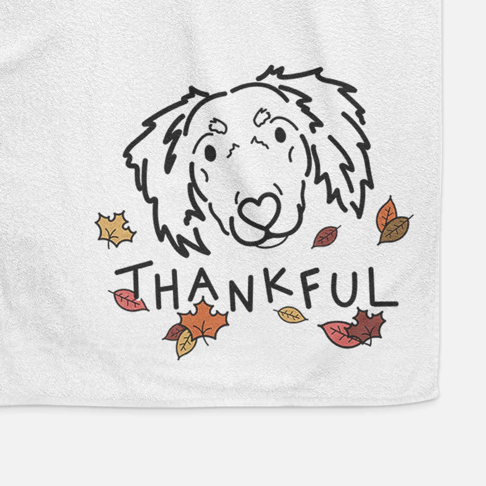 Minimalist line drawing of Tilly the Dachshund Mix with 'Thankful' lettering on a decorative hand towel